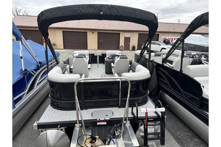 2026 Bennington 20 SSR Quad Bench Tritoon with Yamaha 115 HP, docked and ready.