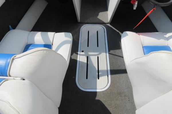 Interior of a 1993 Rinker 186 Captiva boat with white and blue seats.
