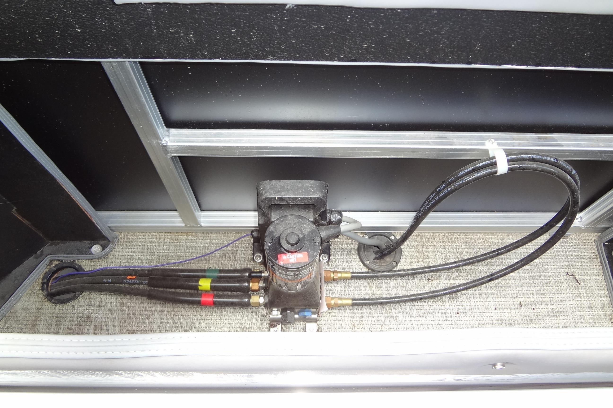 2024 Tahoe Pontoon 2585 VRL hydraulic system with hoses and pump.