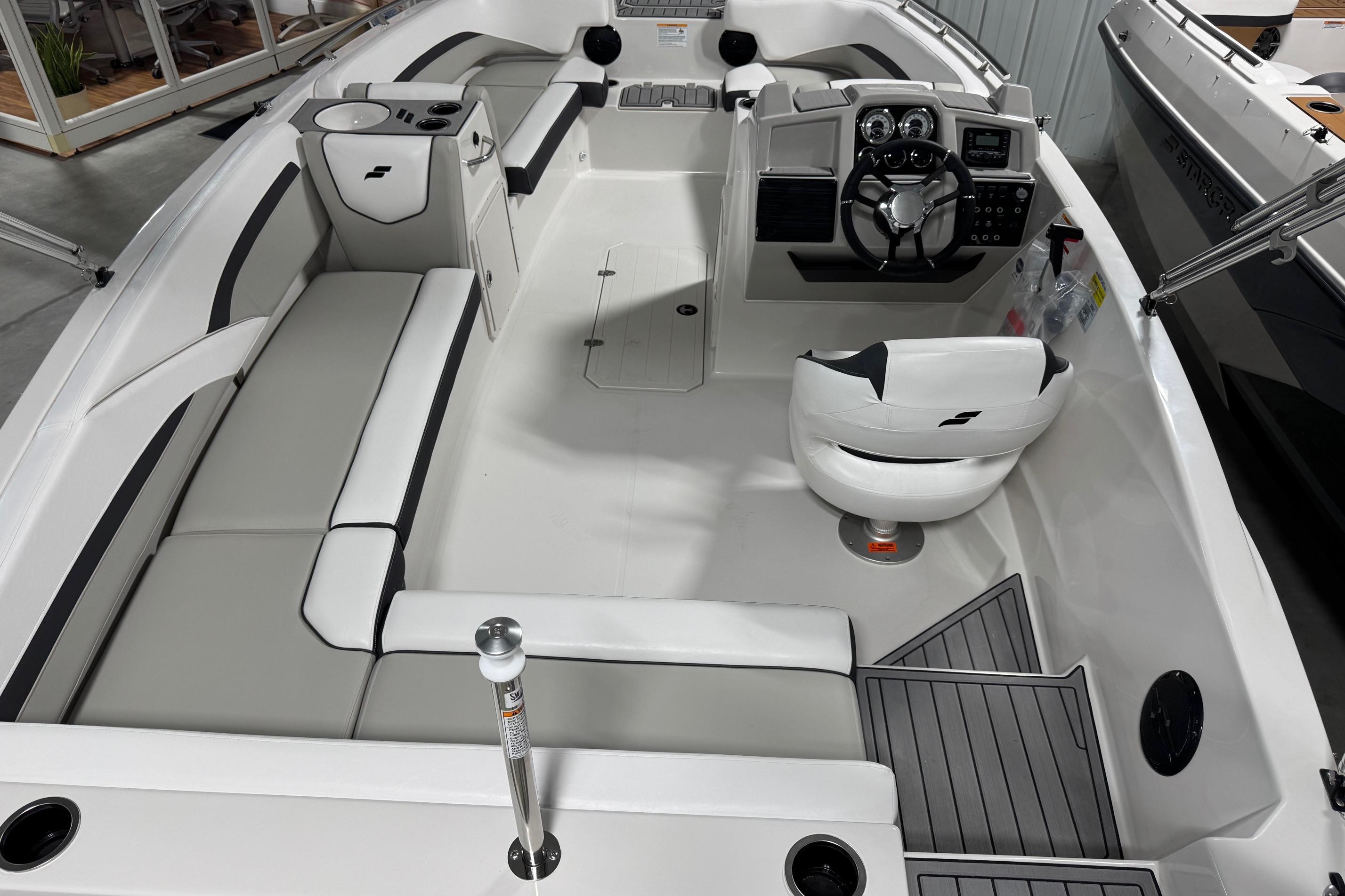 2026 Starcraft SVX 191 OB boat interior with modern seating and steering console.