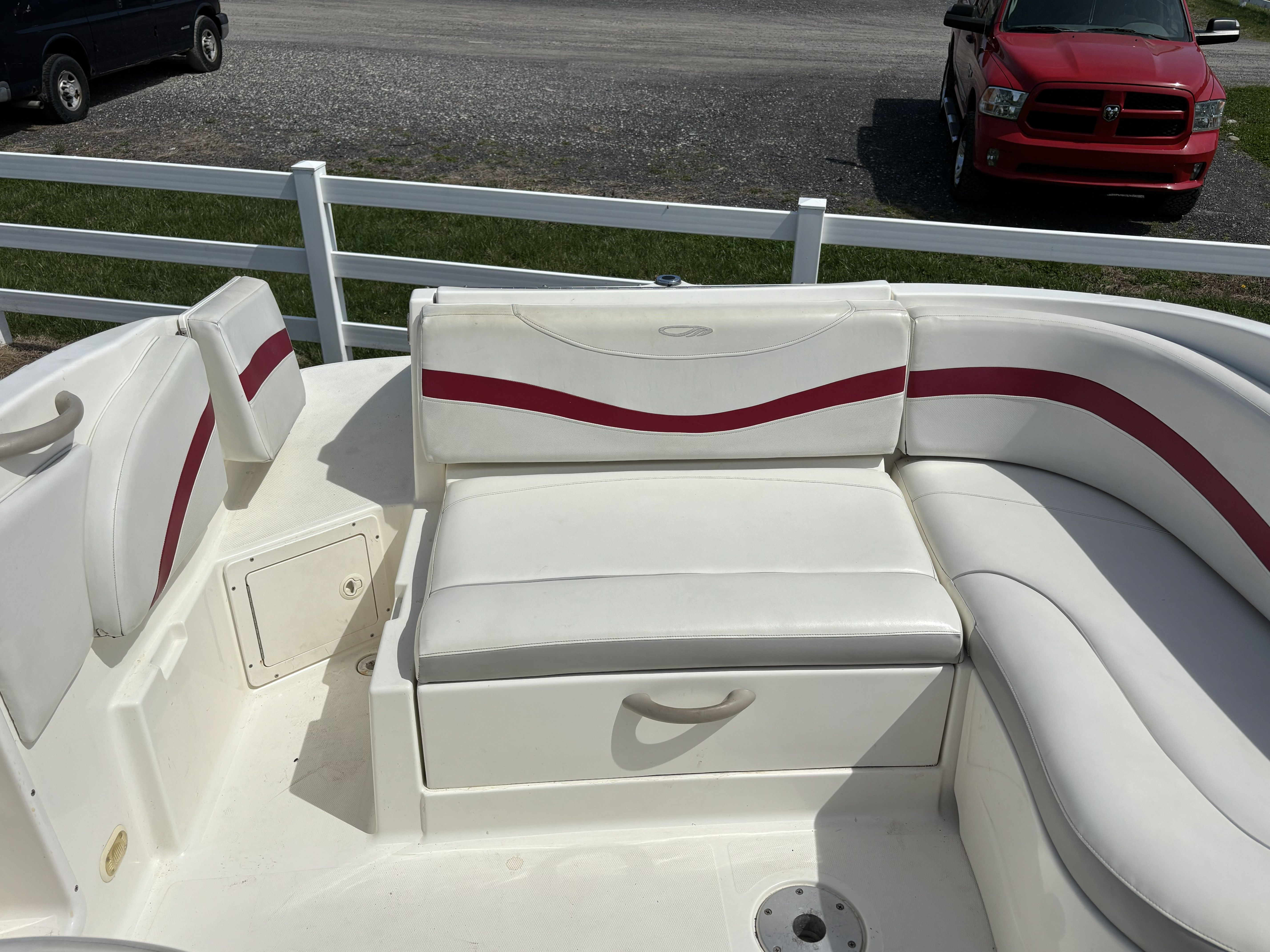 Interior of a 2005 Maxum 2400 SC3 boat with white seating.
