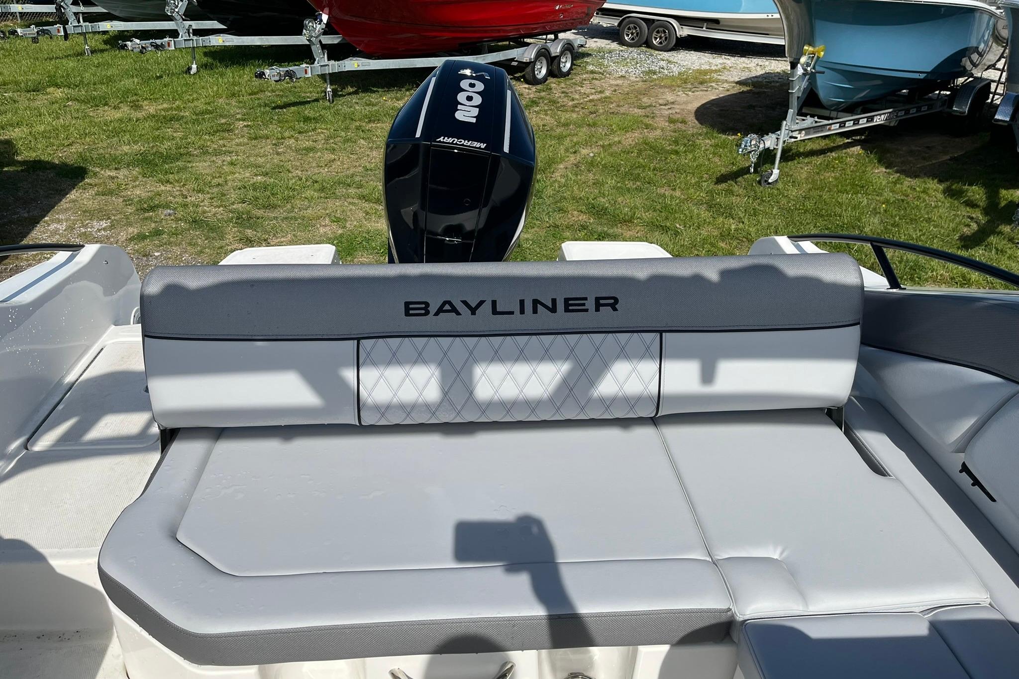 2026 Bayliner D22 boat interior with Mercury engine, featuring comfortable seating.