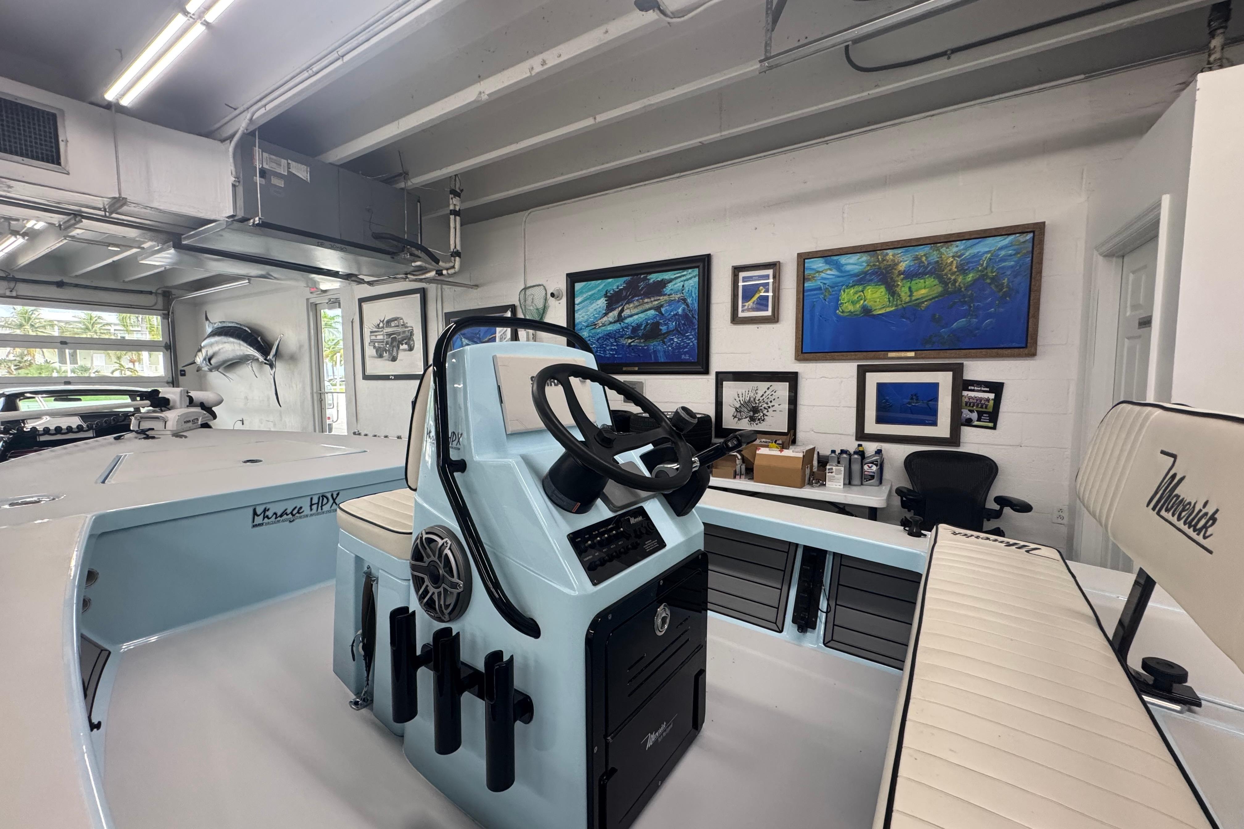 2020 Maverick Mirage 18 HPX-V boat in a garage with nautical decor.