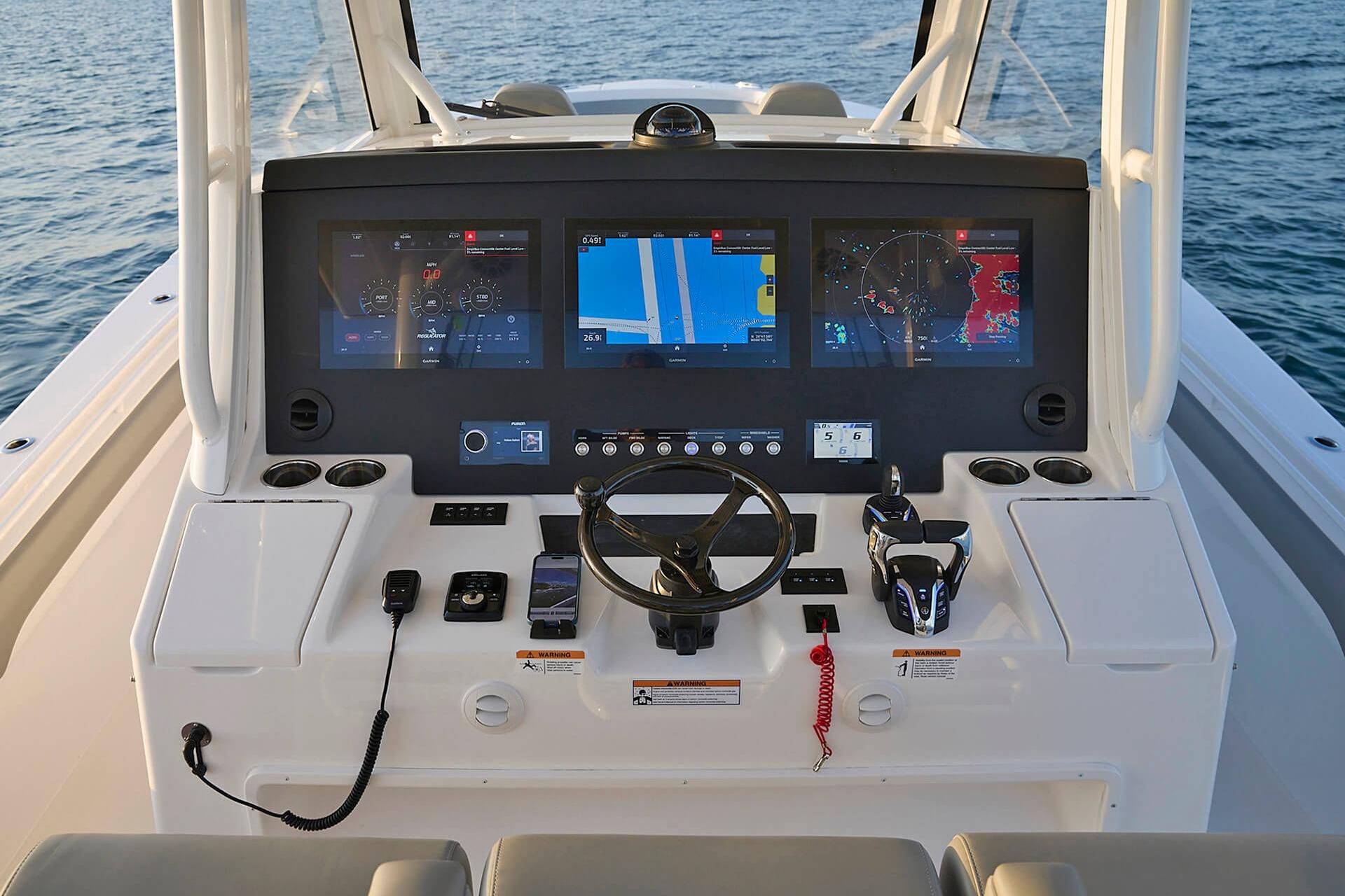 Helm of 2026 Regulator 37 boat with advanced navigation displays and controls.