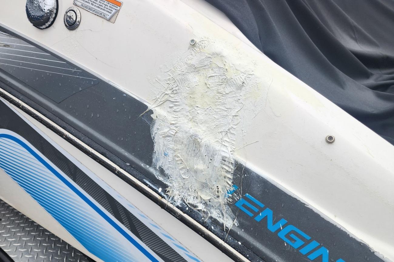 Damaged 2015 Yamaha Boats 212X hull with visible fiberglass repair.