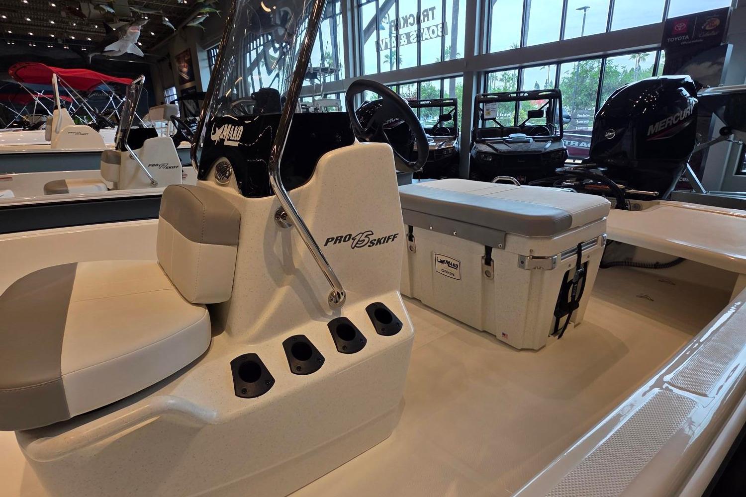 2026 Mako Pro Skiff 15 CC boat interior with seating and storage.