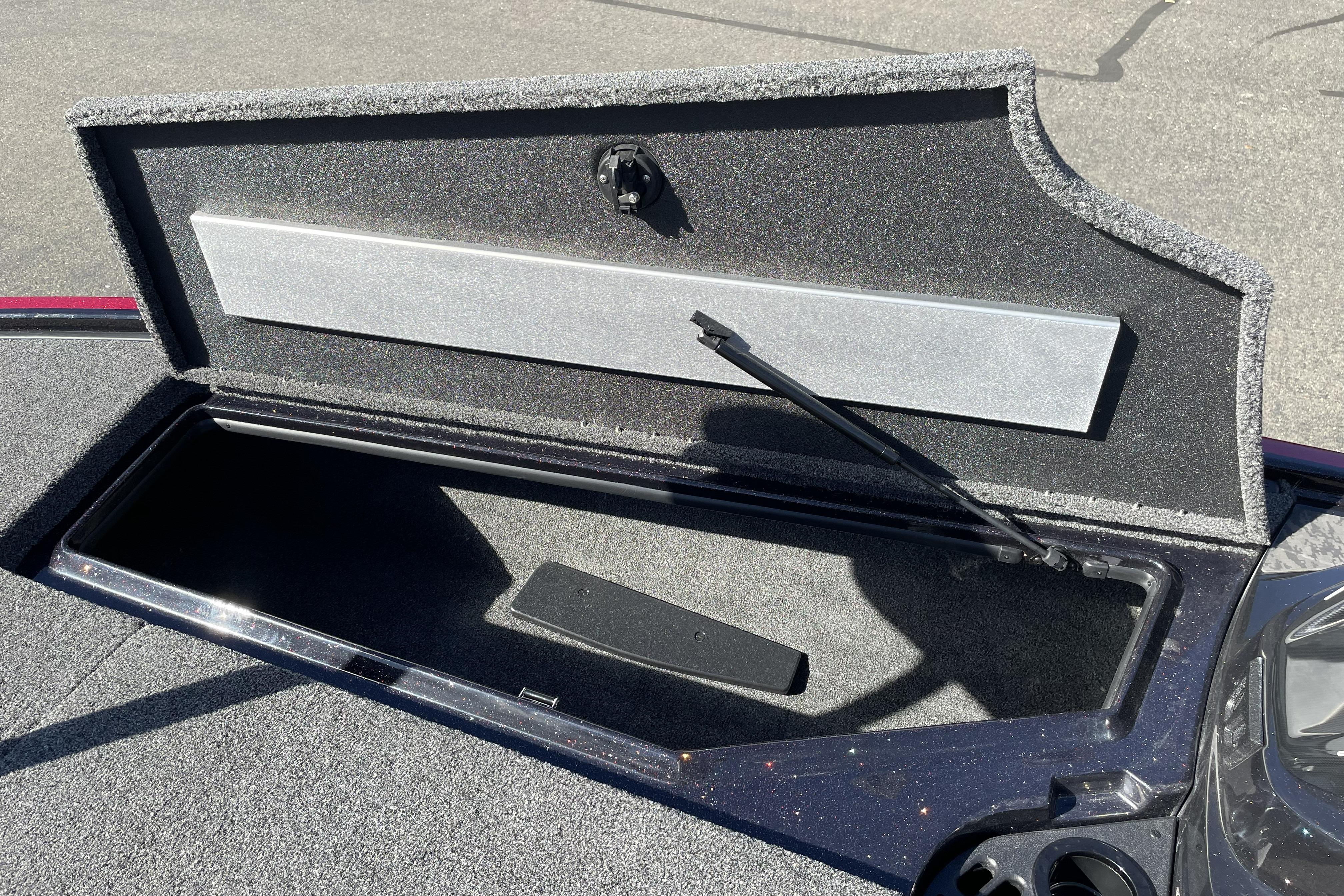 Open storage compartment on 2026 Nitro Z19 XL boat, showing interior details.