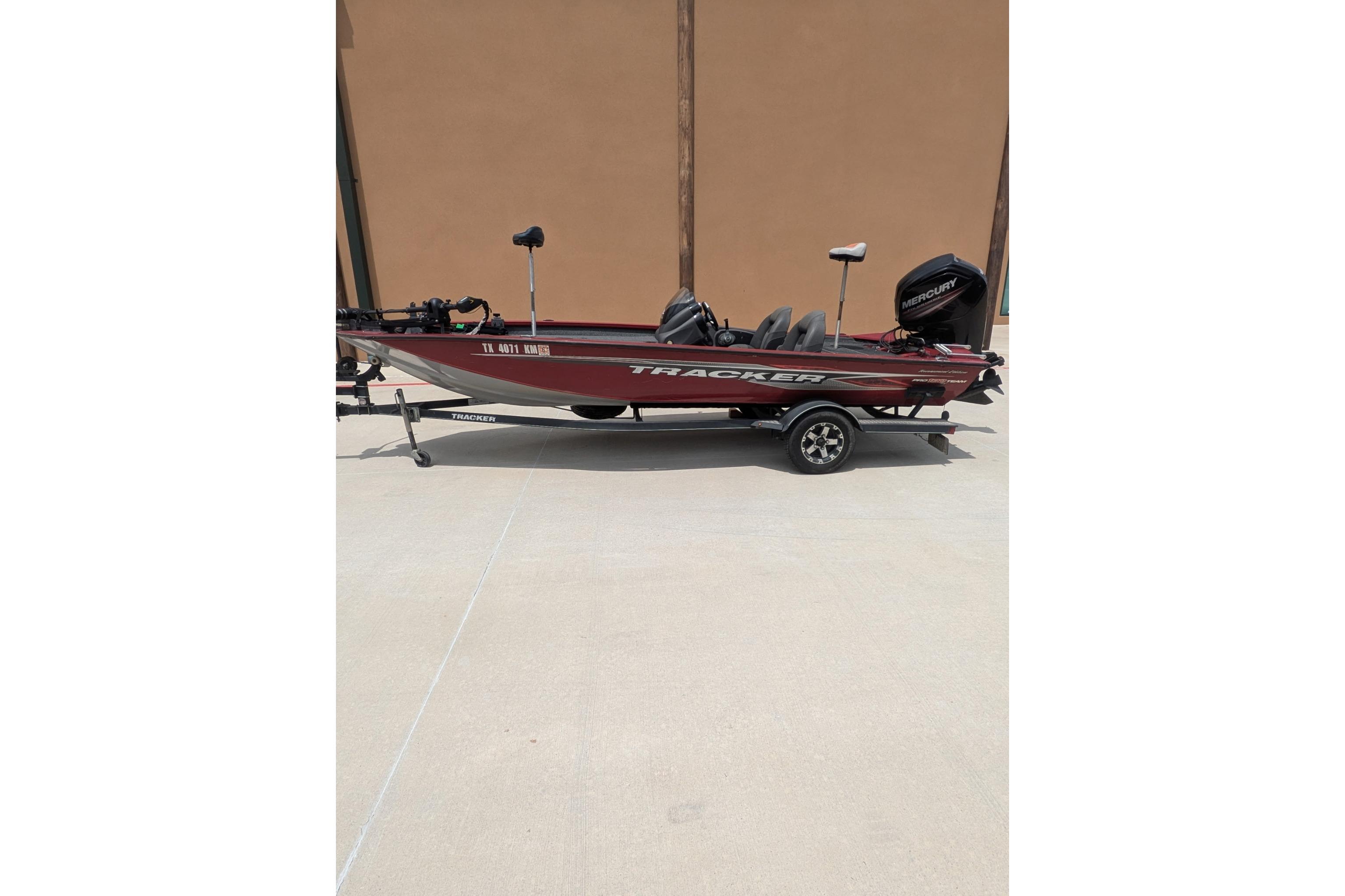 2019 Tracker Pro Team 190 boat on trailer, side view, outdoors.