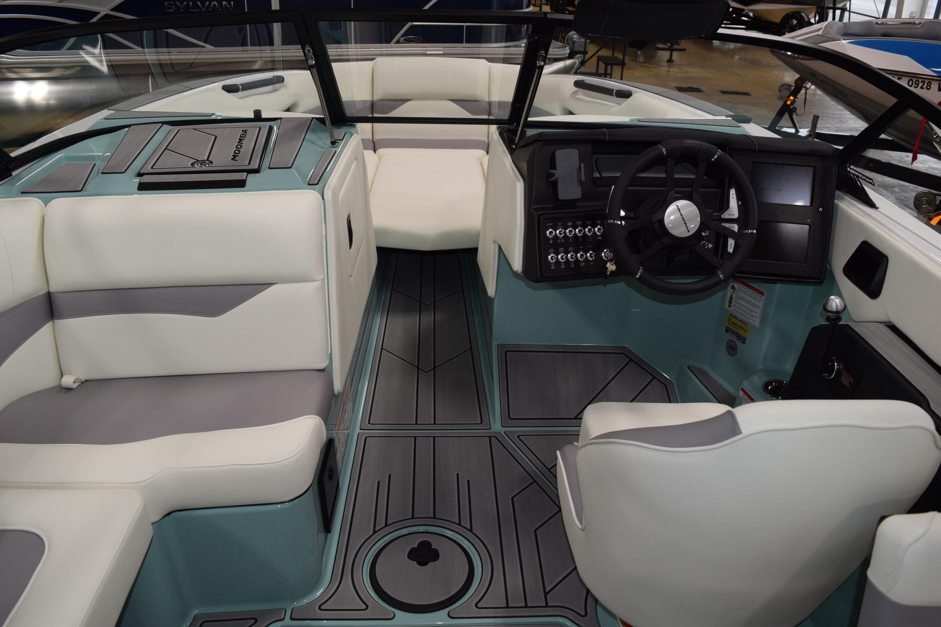 2025 Moomba Mojo boat interior with modern dashboard and seating.