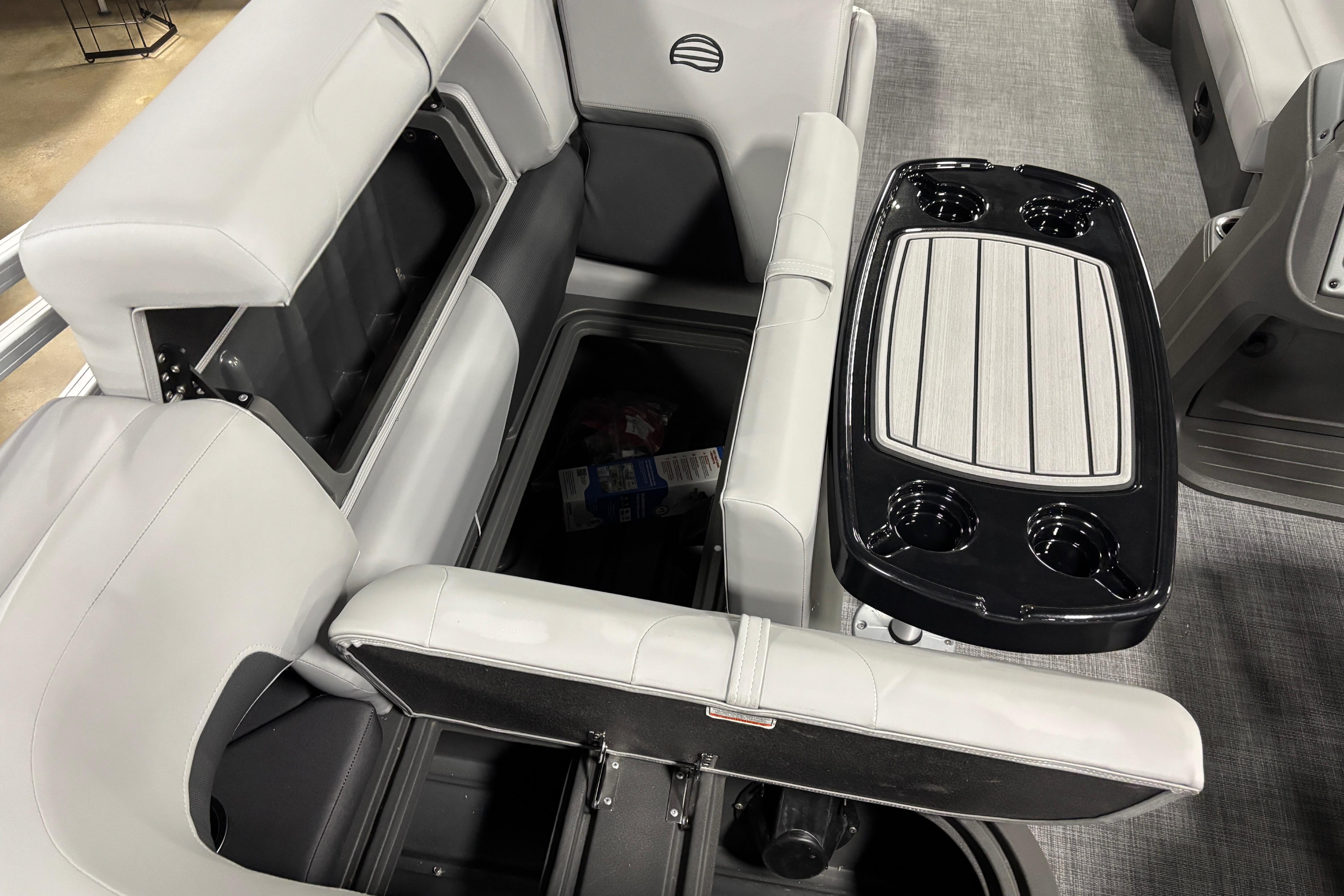 Interior of 2026 Sun Tracker SportFish 20 DLX with seating and table setup.