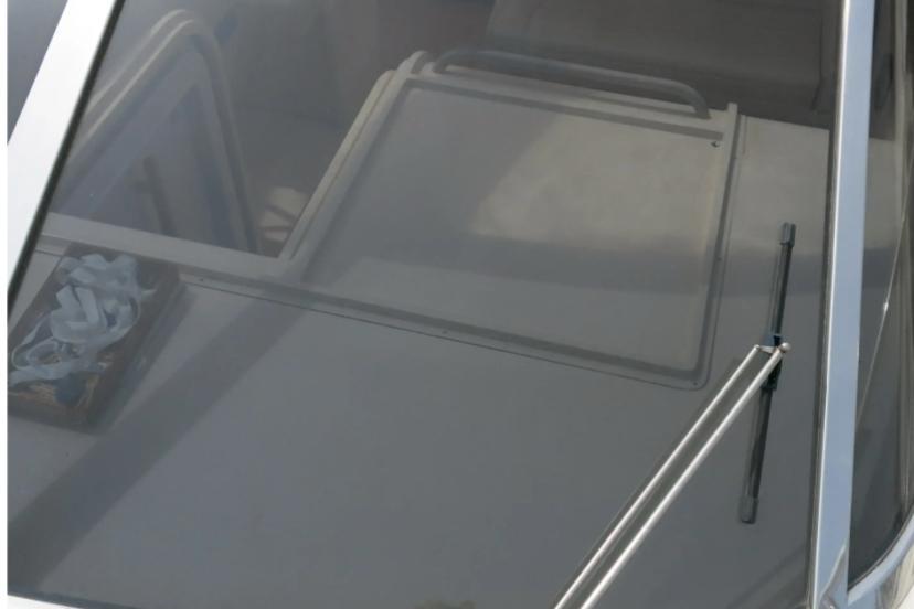 1989 Riva TROPICANA 43 boat interior with windshield wiper and folded seats.