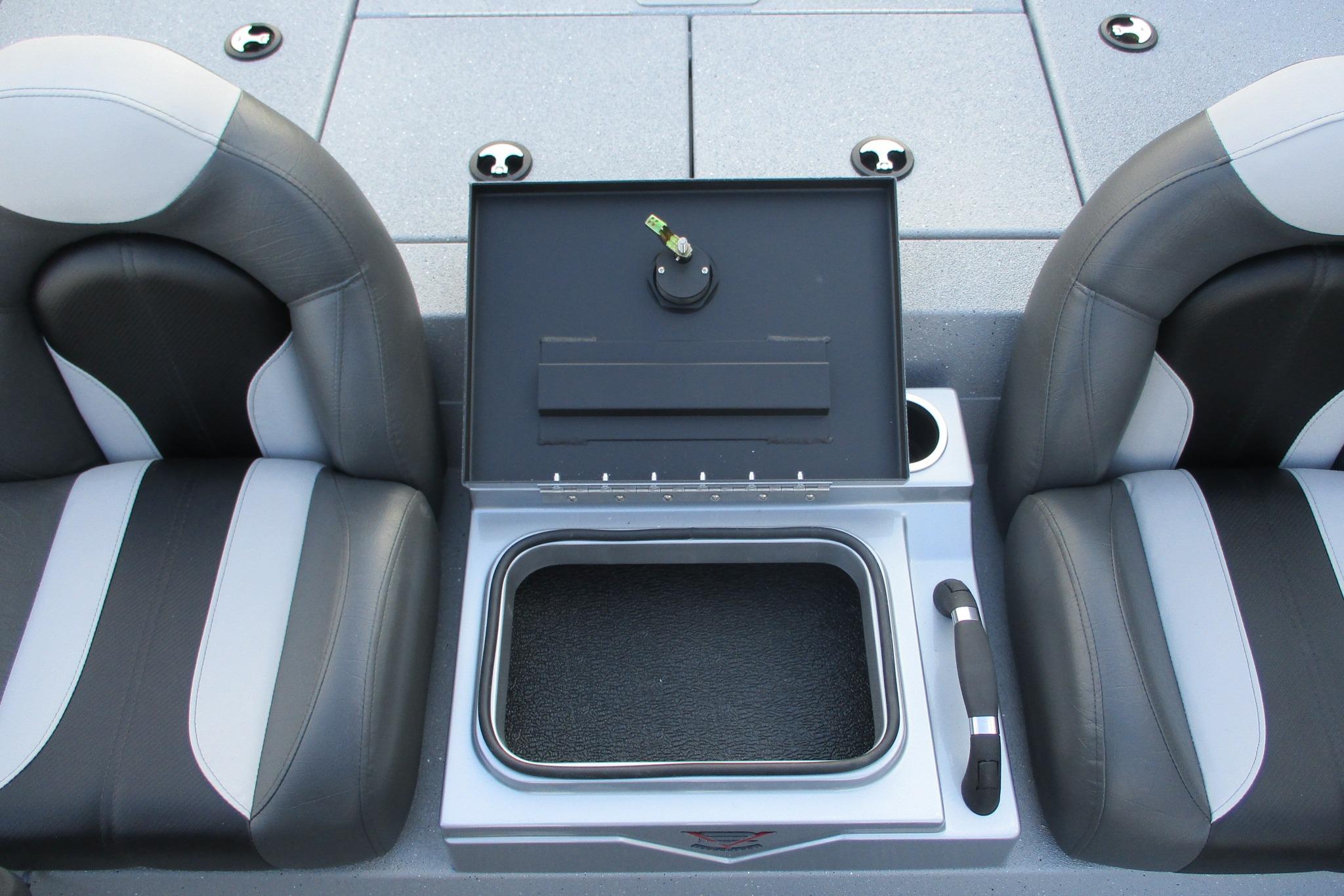 2026 Vexus AVX2080 boat interior with storage compartment between two seats.