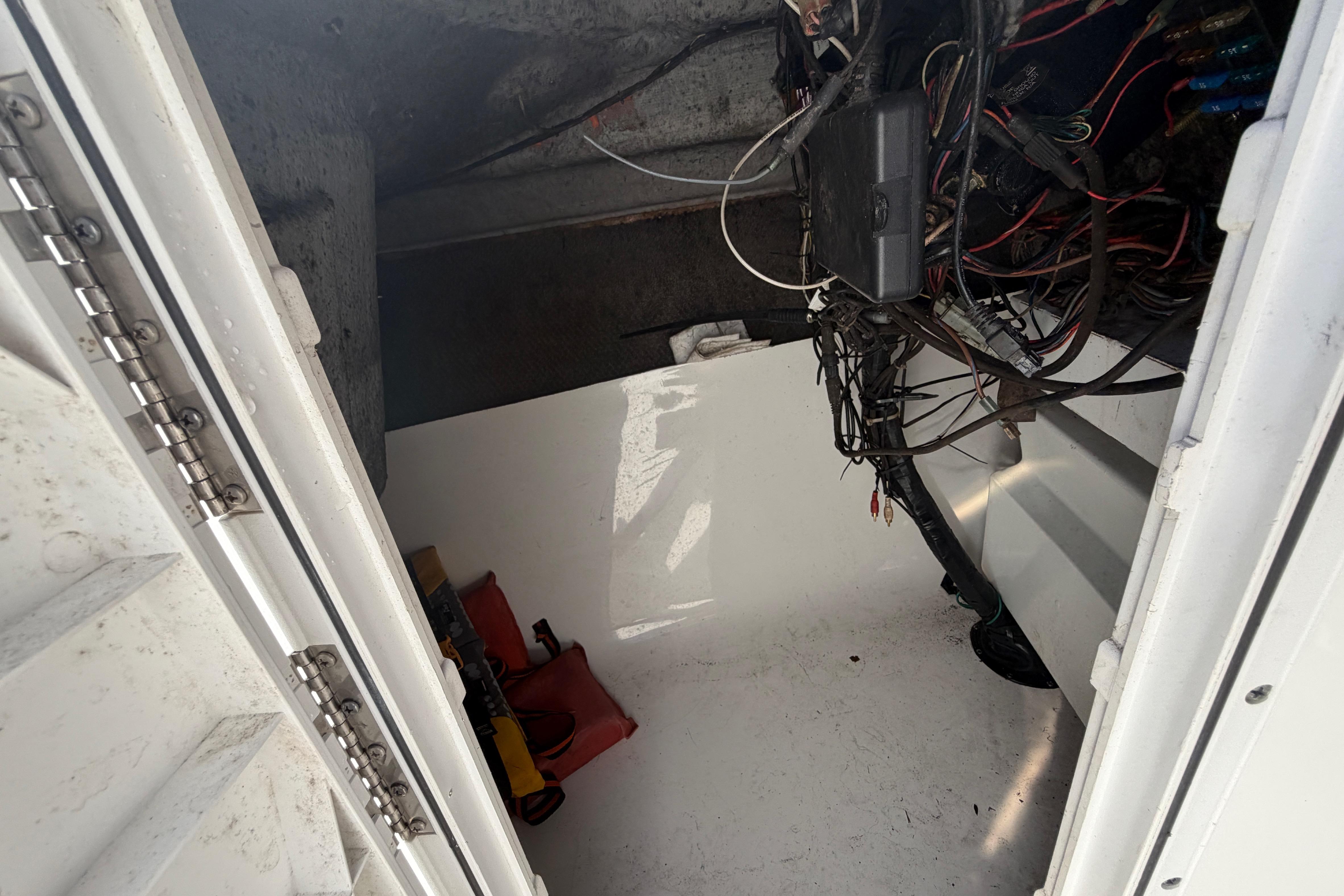 Interior view of a 2008 Sea Fox 216 Dual Console boat's storage compartment.