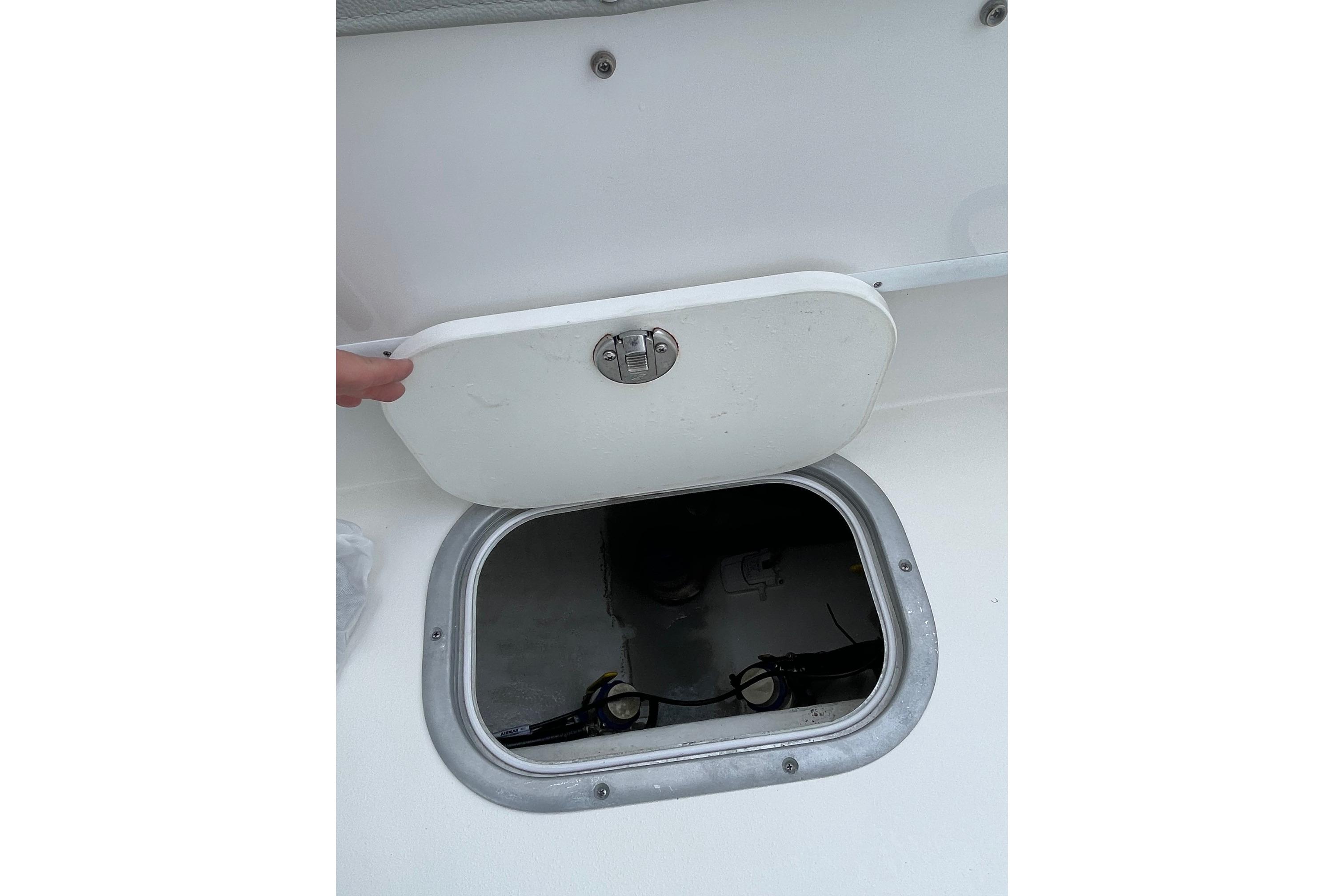 2023 Cape Horn 24 XS boat hatch open, revealing interior compartment.