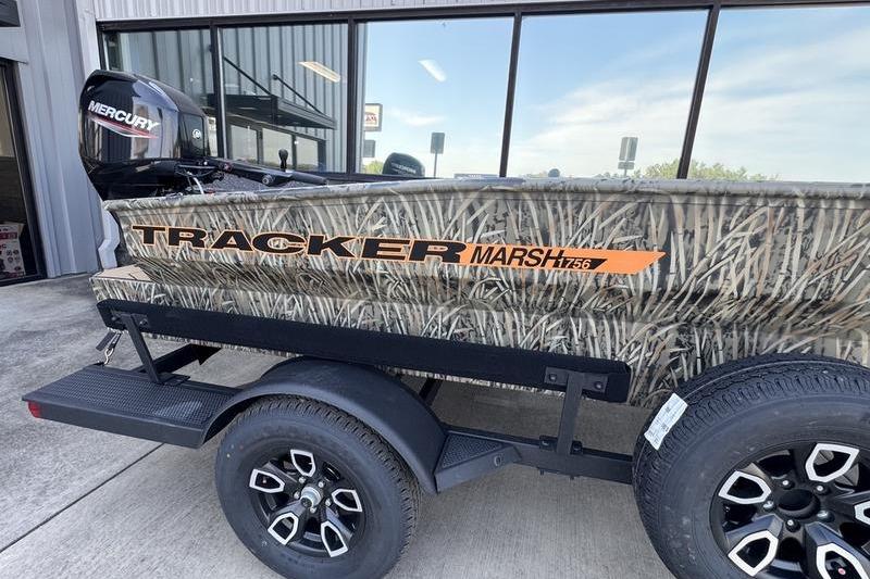 2026 Tracker Grizzly 1756 T Marsh boat with camo design and Mercury outboard motor.