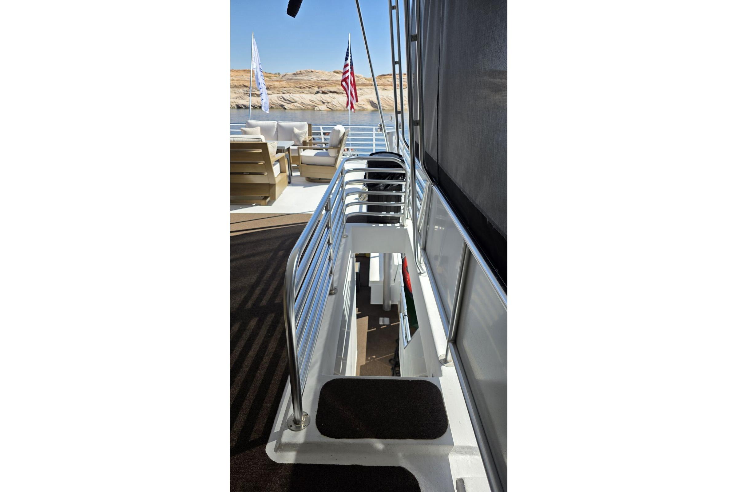 Modern Sumerset Excellence Multiple Shares 2025 yacht deck with seating and American flag.