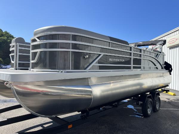 2024 Bennington 22 SVSR pontoon boat on trailer, silver exterior, parked outdoors.