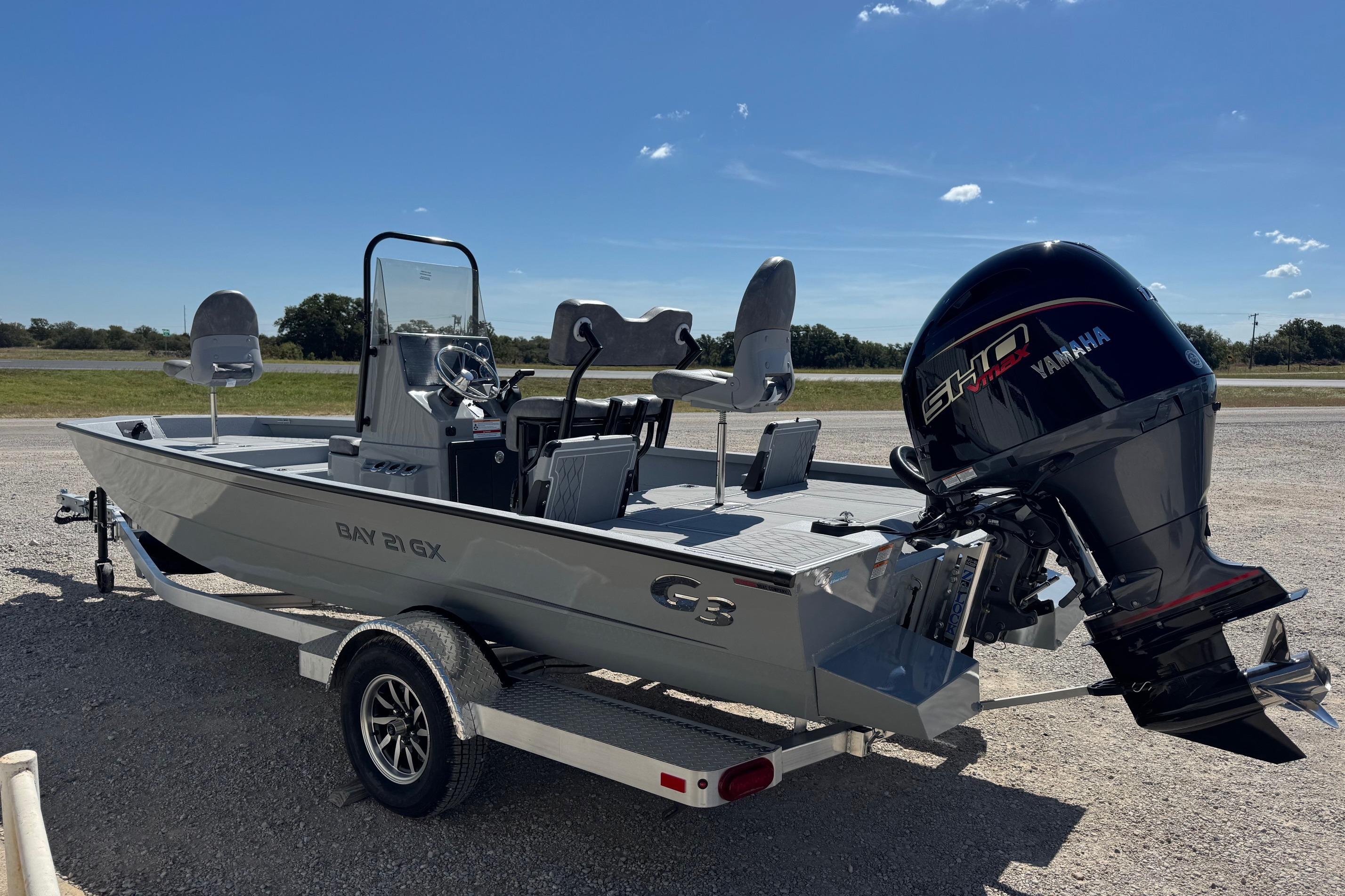 2026 G3 21GX boat with Yamaha engine on a trailer, parked outdoors.