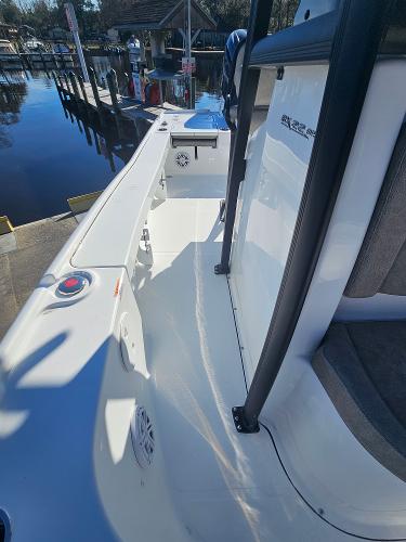 2026 Sea Hunt BX 22 BR boat interior, featuring sleek design and modern amenities at a dock.