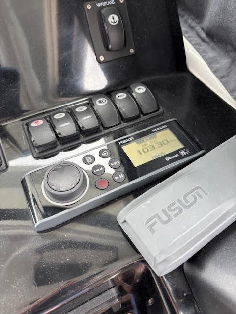 Control panel of a 2019 Beneteau Antares 27 with Fusion marine stereo system.