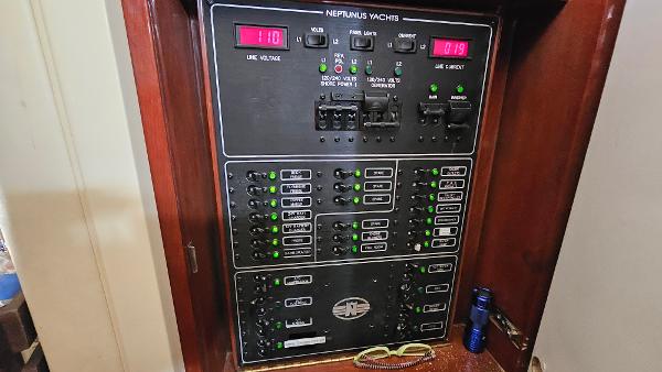 Electrical panel of 2005 Neptunus 56 Flybridge yacht with control switches and indicators.