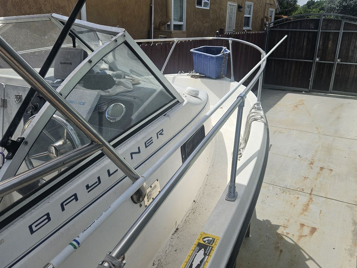 1999 Trophy 2052 Walkaround boat parked in driveway.