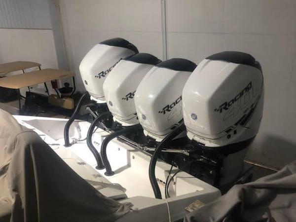 Four powerful outboard engines on a 2019 Midnight Express 39 Cuddy boat.