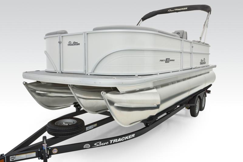 2026 Sun Tracker Party Barge 22 DLX pontoon boat on trailer, side view.