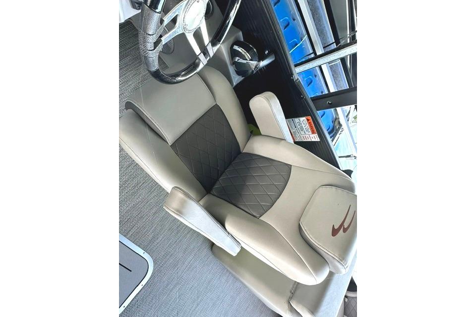 Captain's seat of 2021 Bennington L Bowrider 25 Quad Bench, featuring elegant design and comfort.