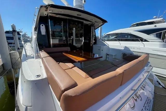 2016 Sea Ray Sundancer 510 yacht with spacious outdoor seating and table.