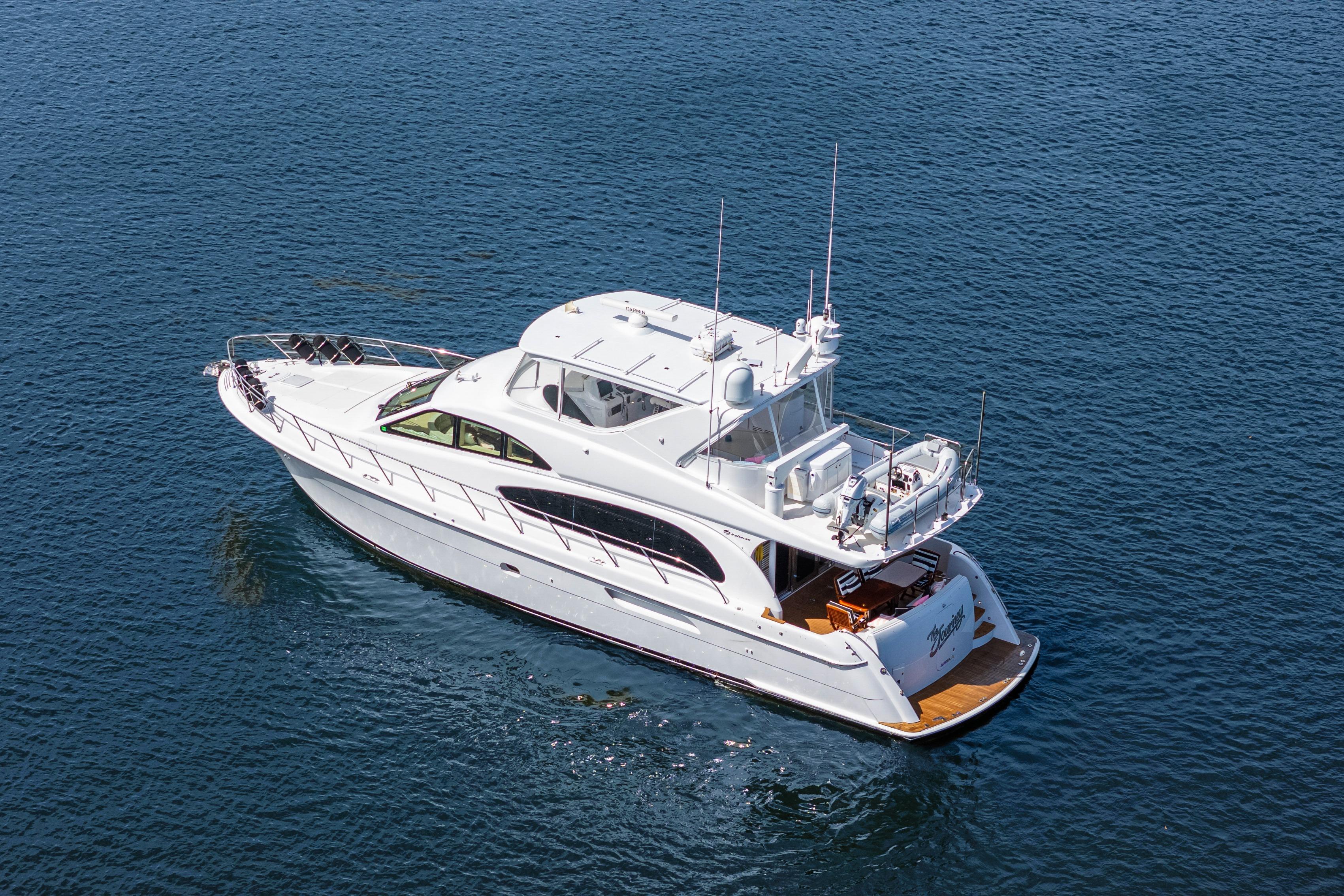 2008 Hatteras 64 Motor Yacht cruising on open water.