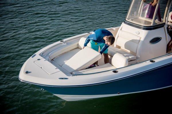 Manufacturer Provided Image: 2018 Grady-White Fisherman 216 boat on water with person adjusting seating.