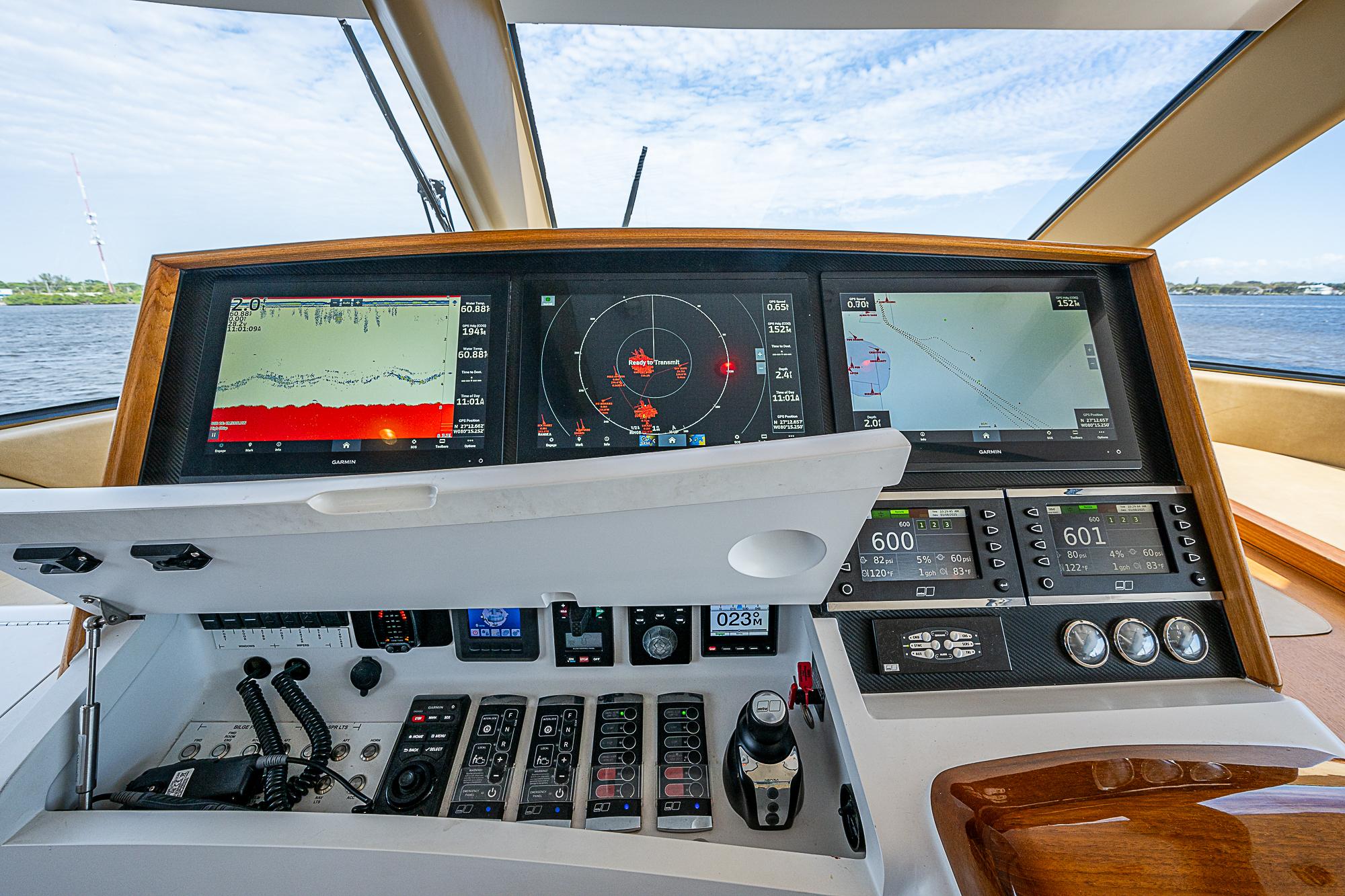 Control panel of 2017 F&S Custom Express Sportfish with navigation screens and instruments.