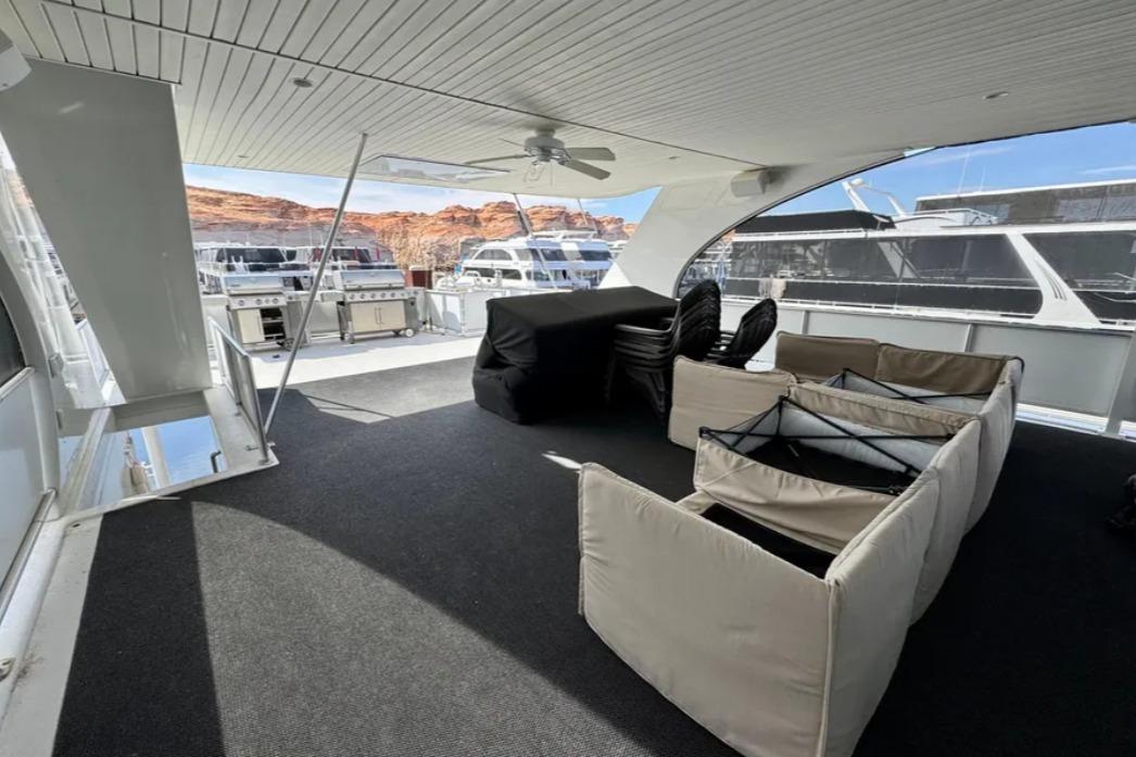 Spacious deck of 2012 Bravada Helios Share #8 with outdoor seating and grills.