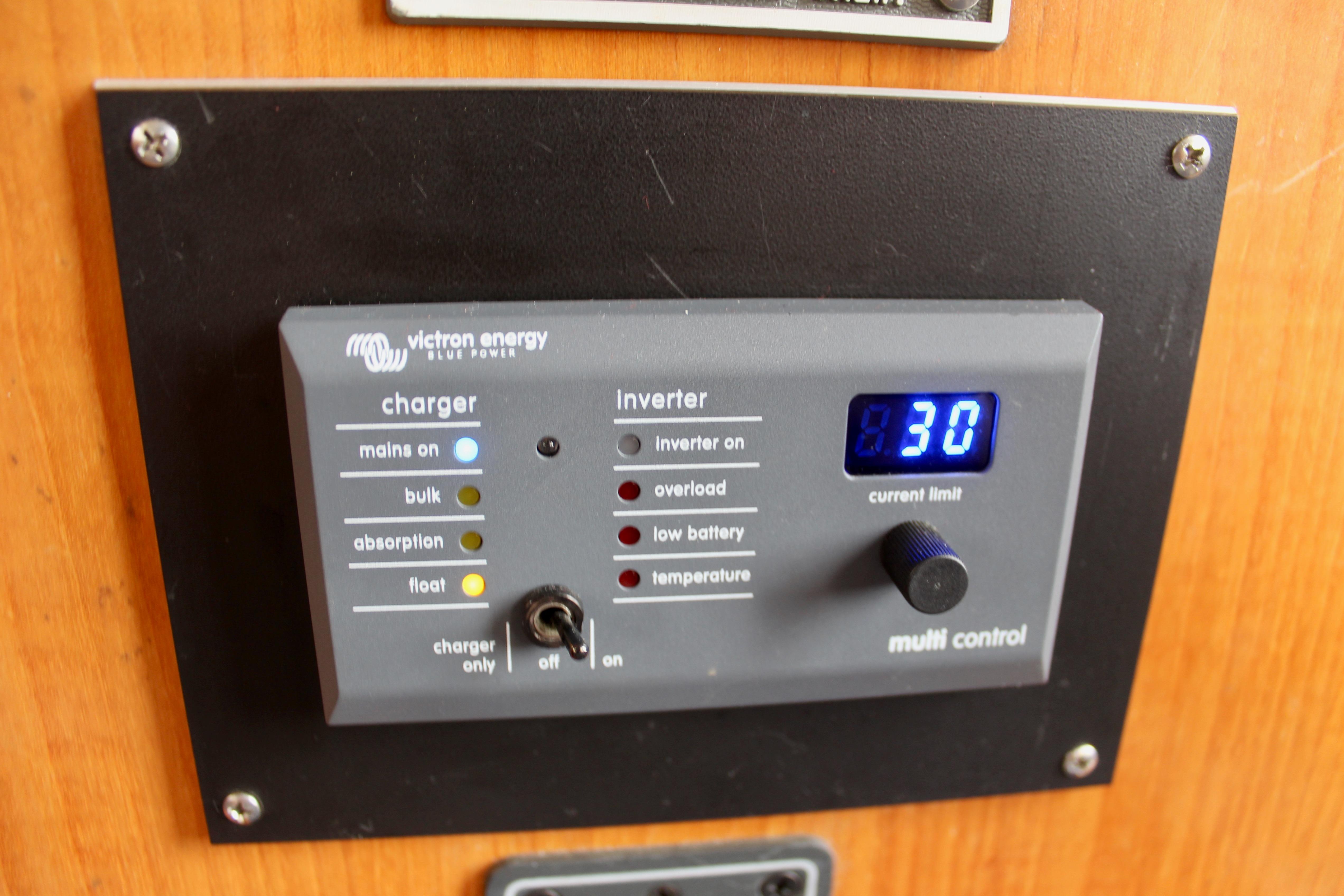 Control panel of a 1986 Kha Shing Spindrift 46 with Victron Energy charger and inverter settings.