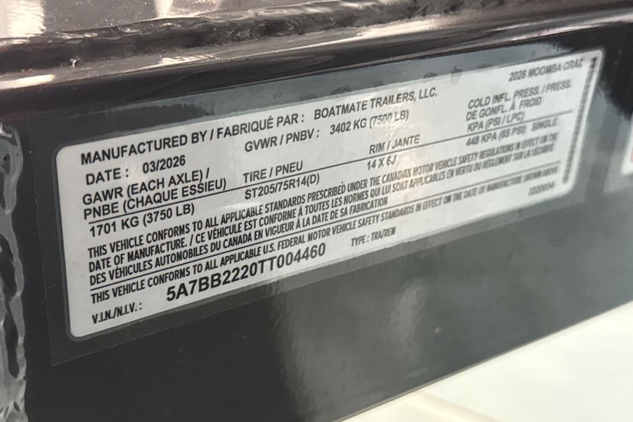 Close-up of a boat label showing technical specifications and manufacturer details.