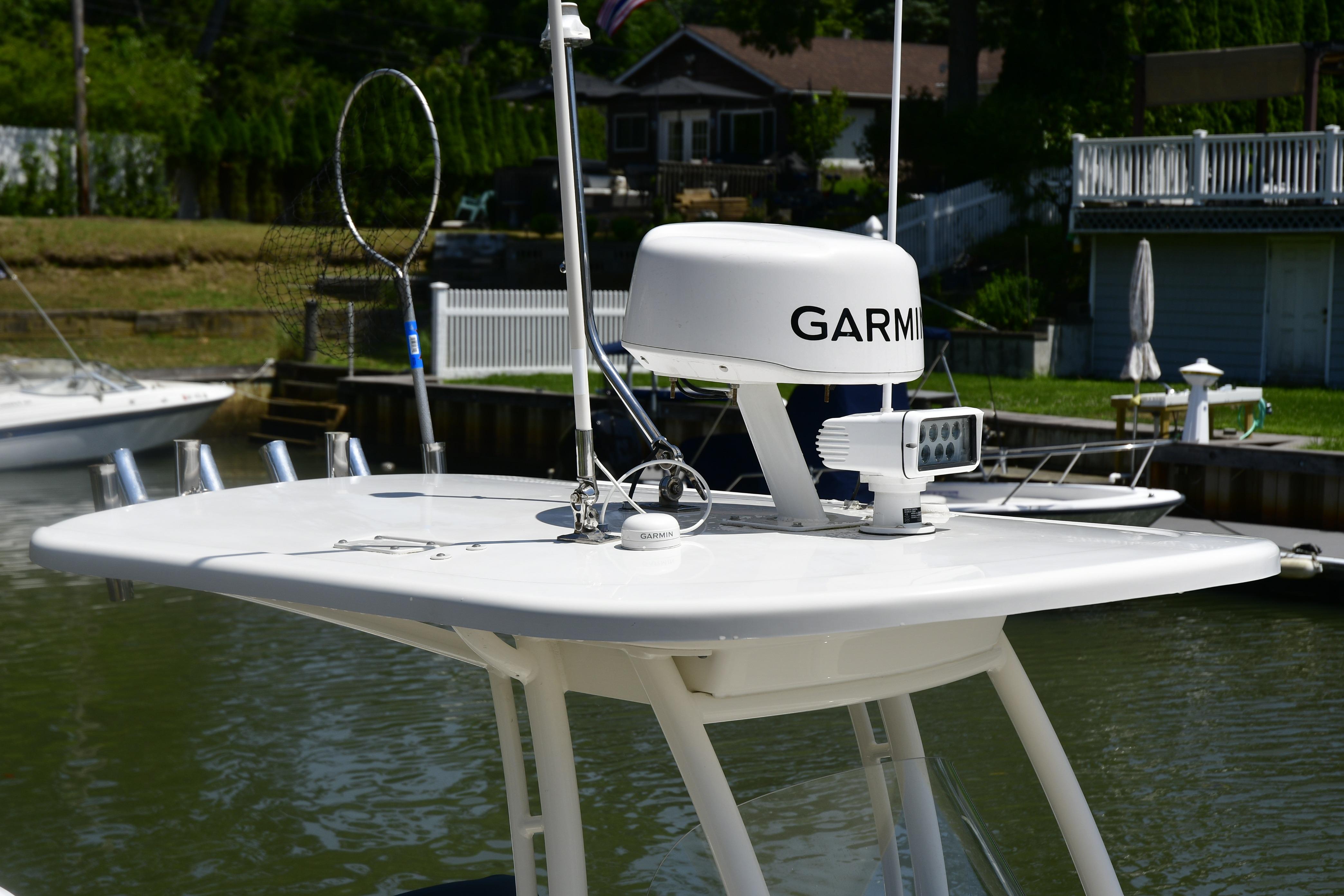 2020 Pursuit C 238 Center Console with Garmin radar and spotlight on top.