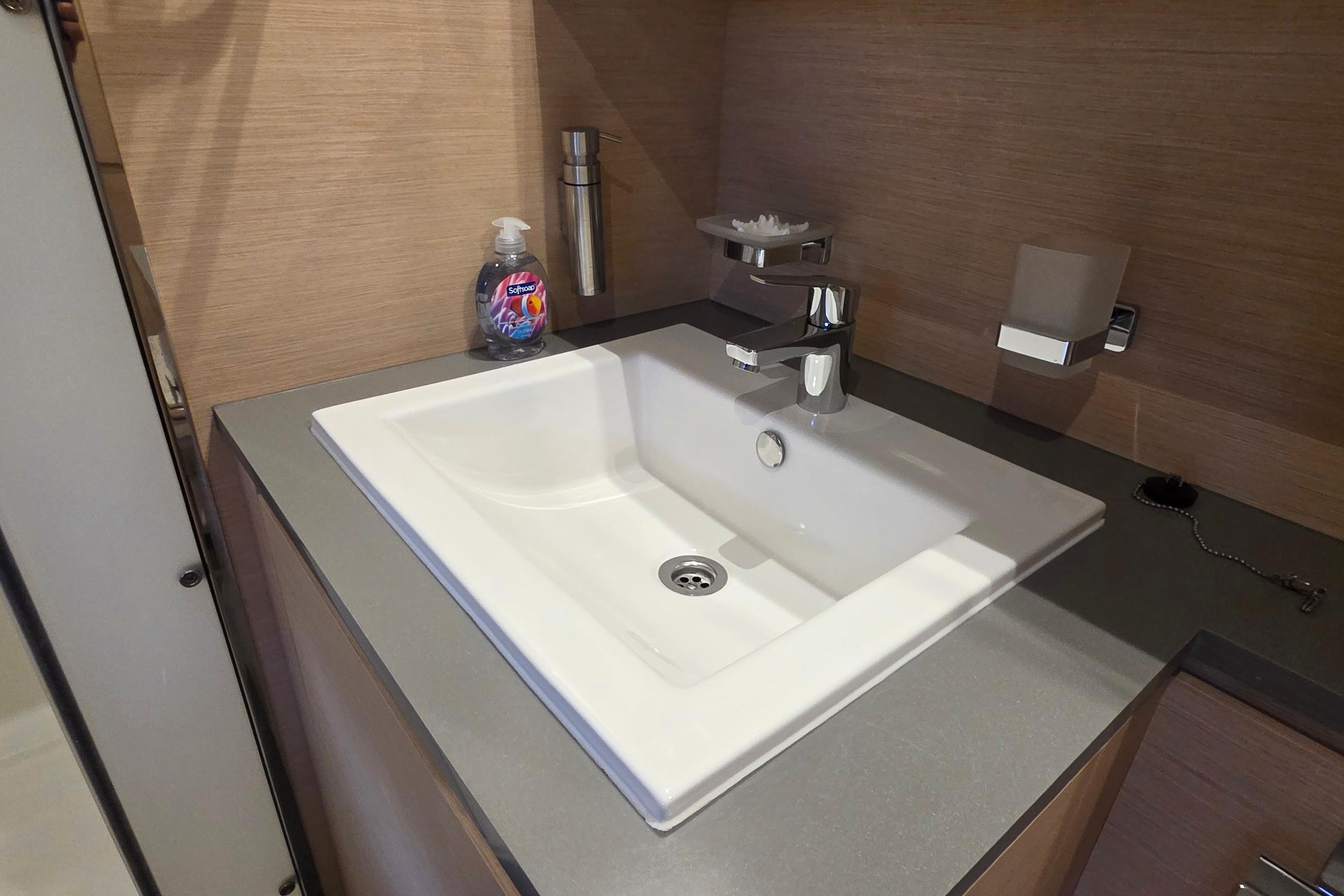 Modern bathroom sink on 2018 Fountaine Pajot Motor Yacht 44, featuring sleek design and fixtures.