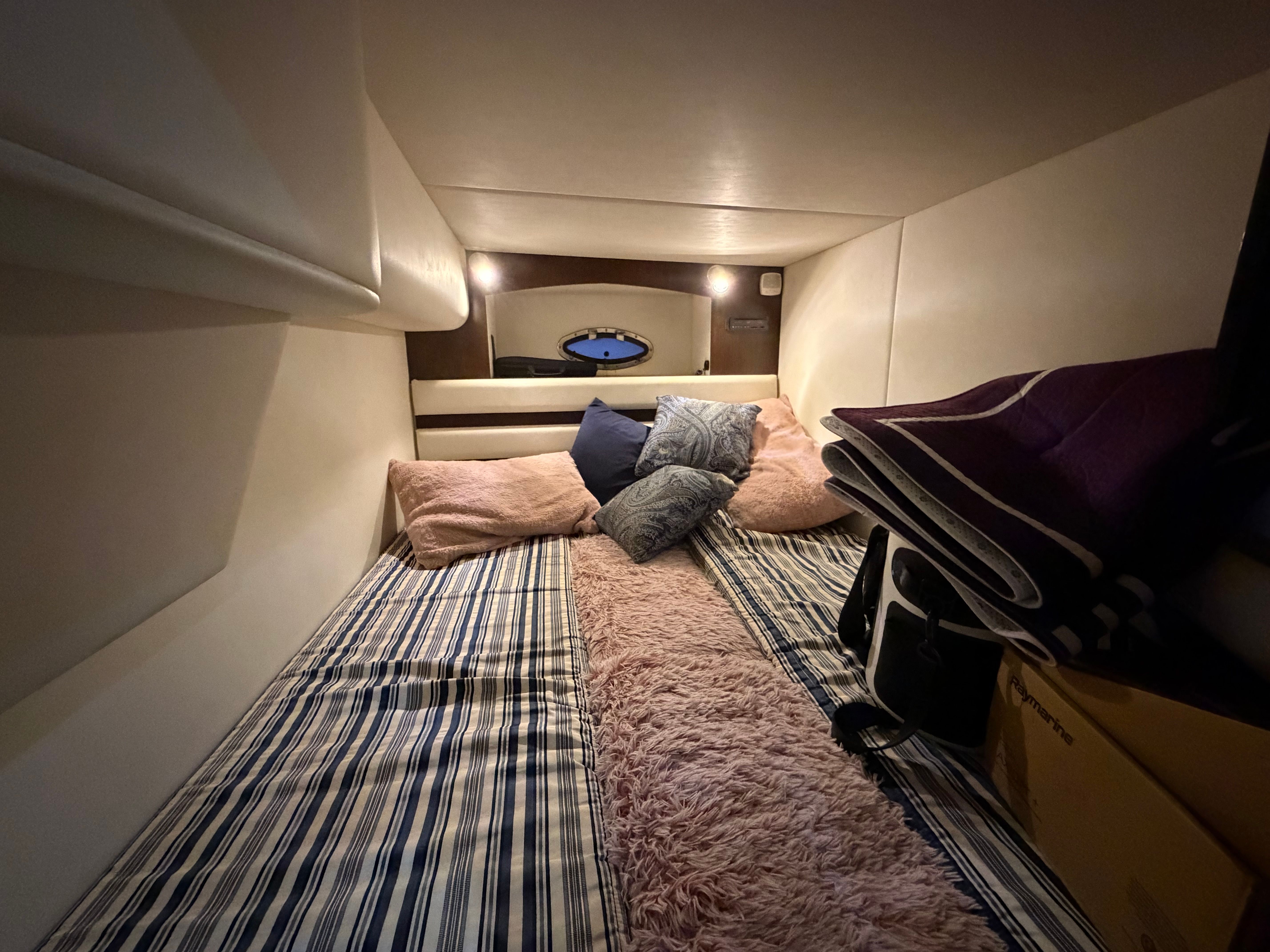 Interior of 2012 Cruisers Yachts 430 Sports Coupe with cozy bed.