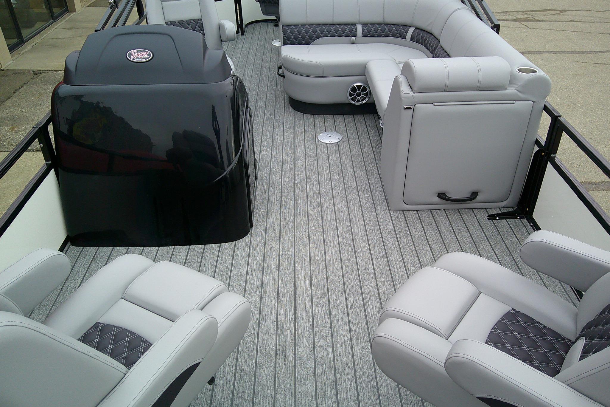 Luxurious interior of 2026 Ranger 220F boat with plush seating and sleek design.