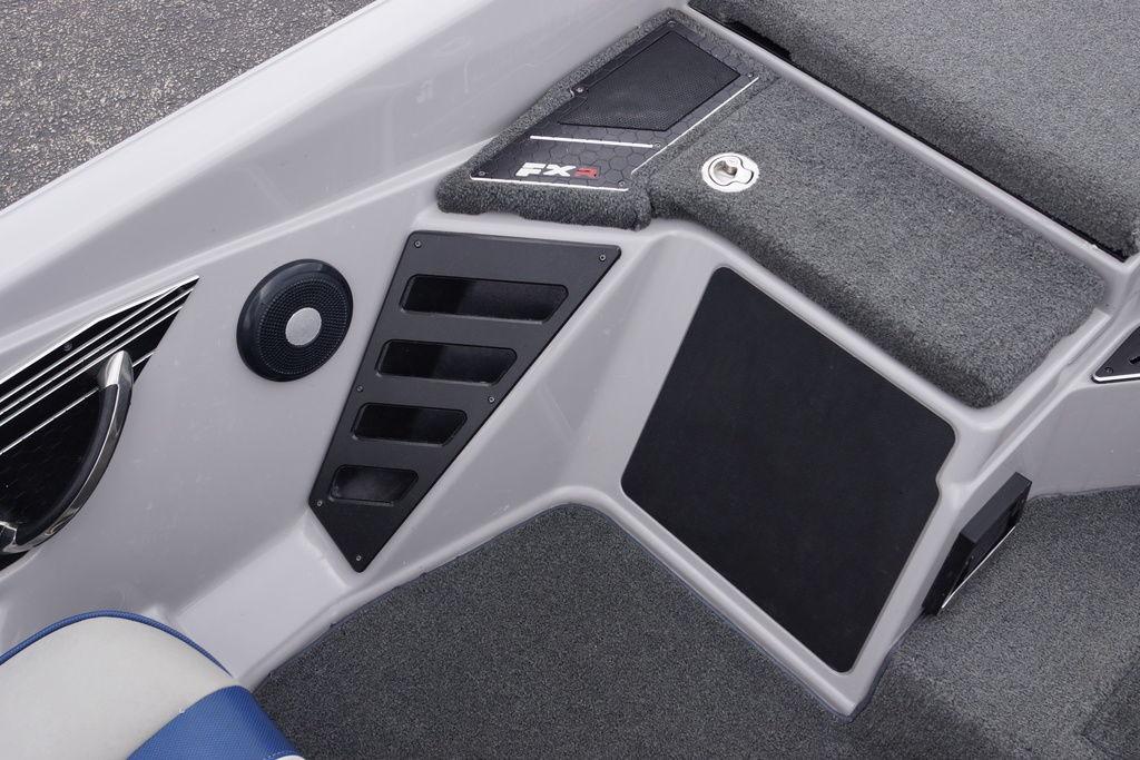 2020 Skeeter FXR21 Limited boat interior with speaker and carpeted surfaces.