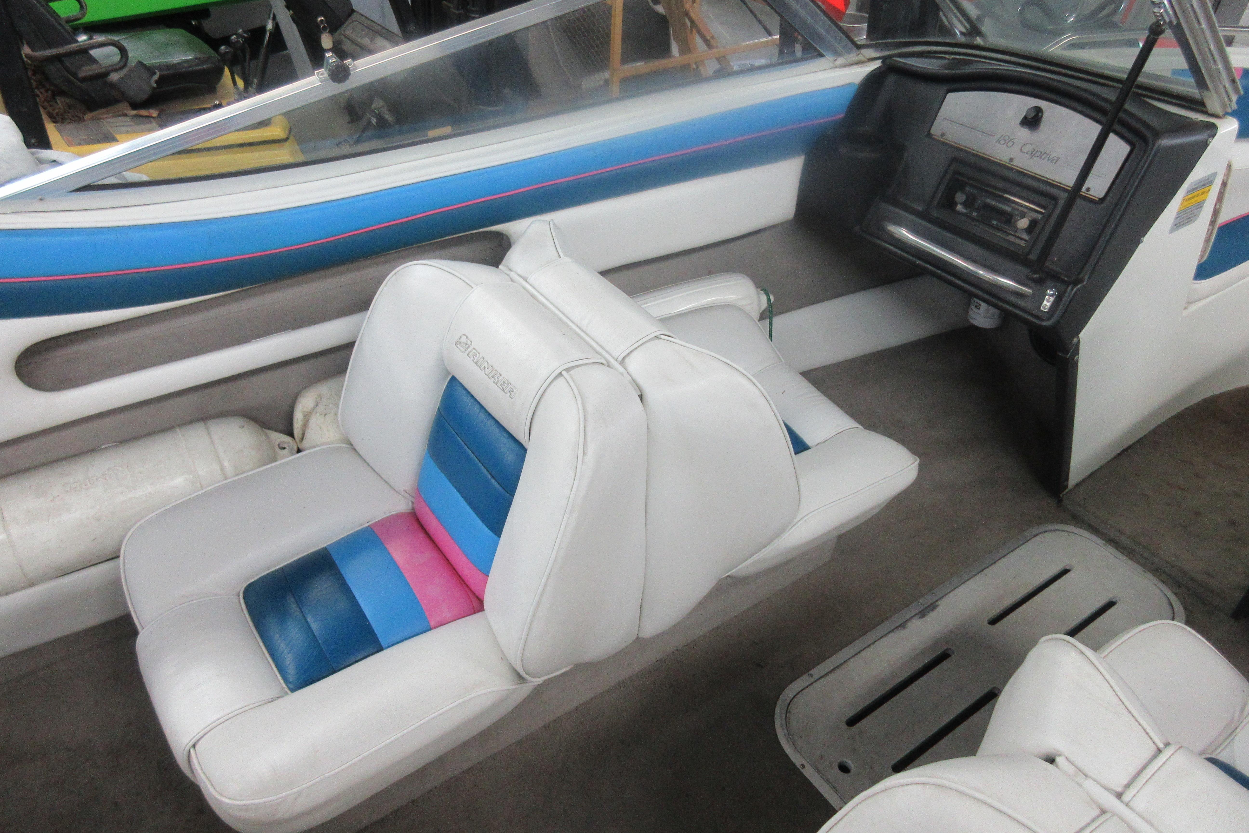 1993 Rinker 186 Captiva Bowrider interior with white and blue seating.