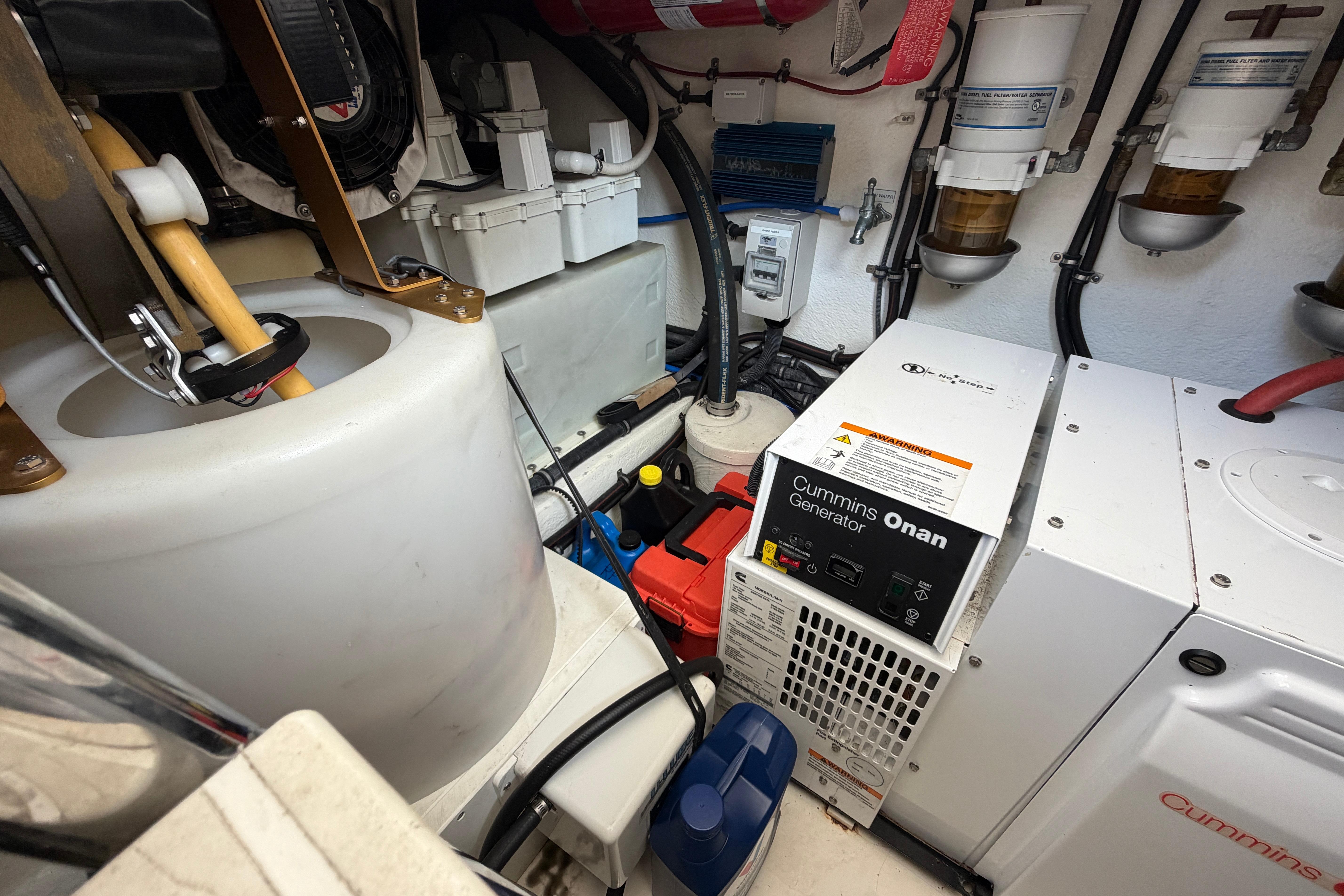 Forward engine room of 2015 Riviera 445 SUV with Cummins Onan generator and equipment