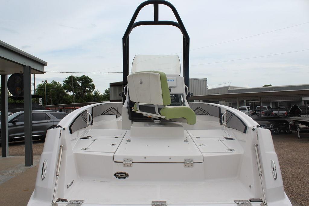 2017 Scarab 195 boat with green seating, viewed from the rear in a parking area.