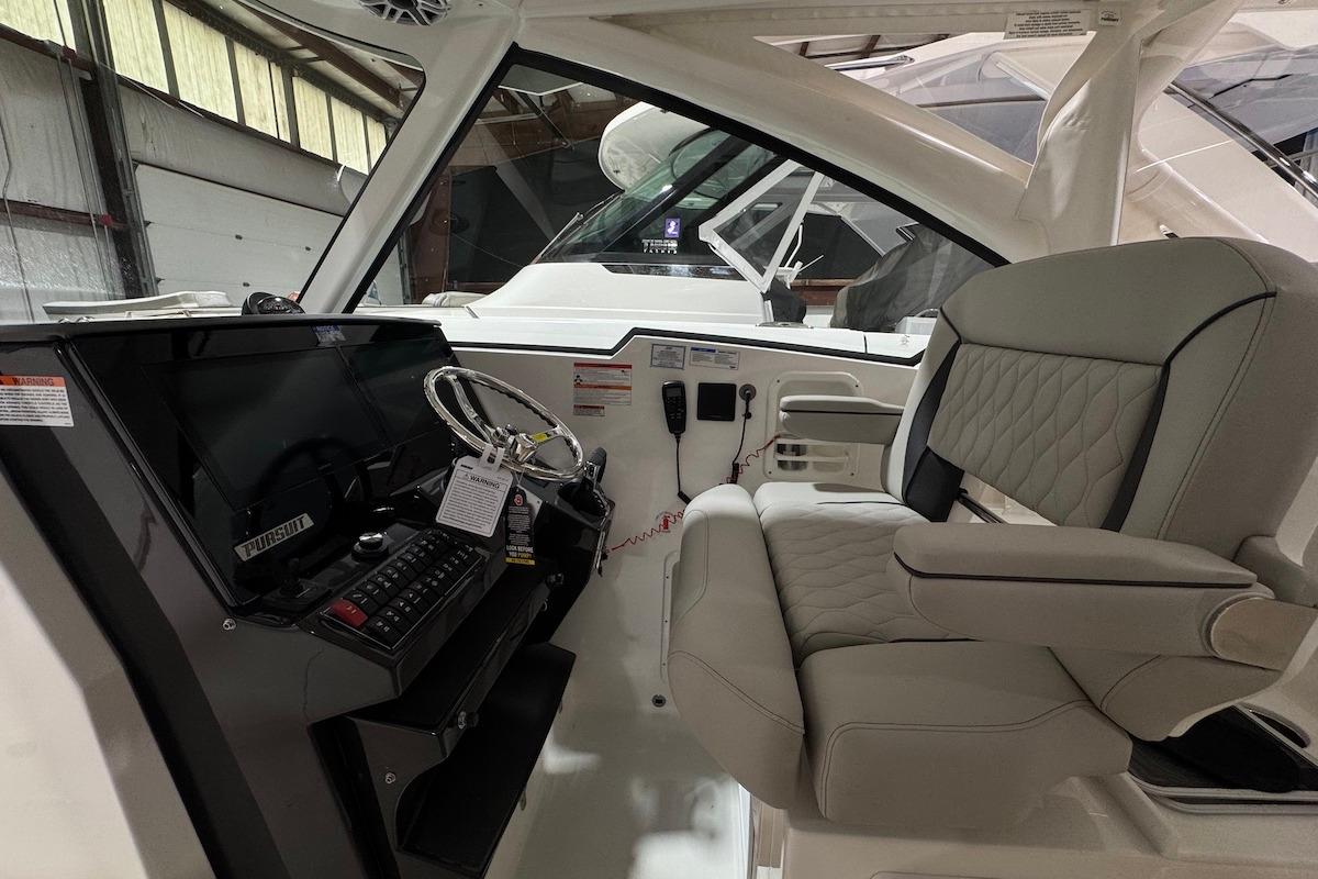 2026 Pursuit DC 326 Dual Console interior with modern helm and comfortable seating.