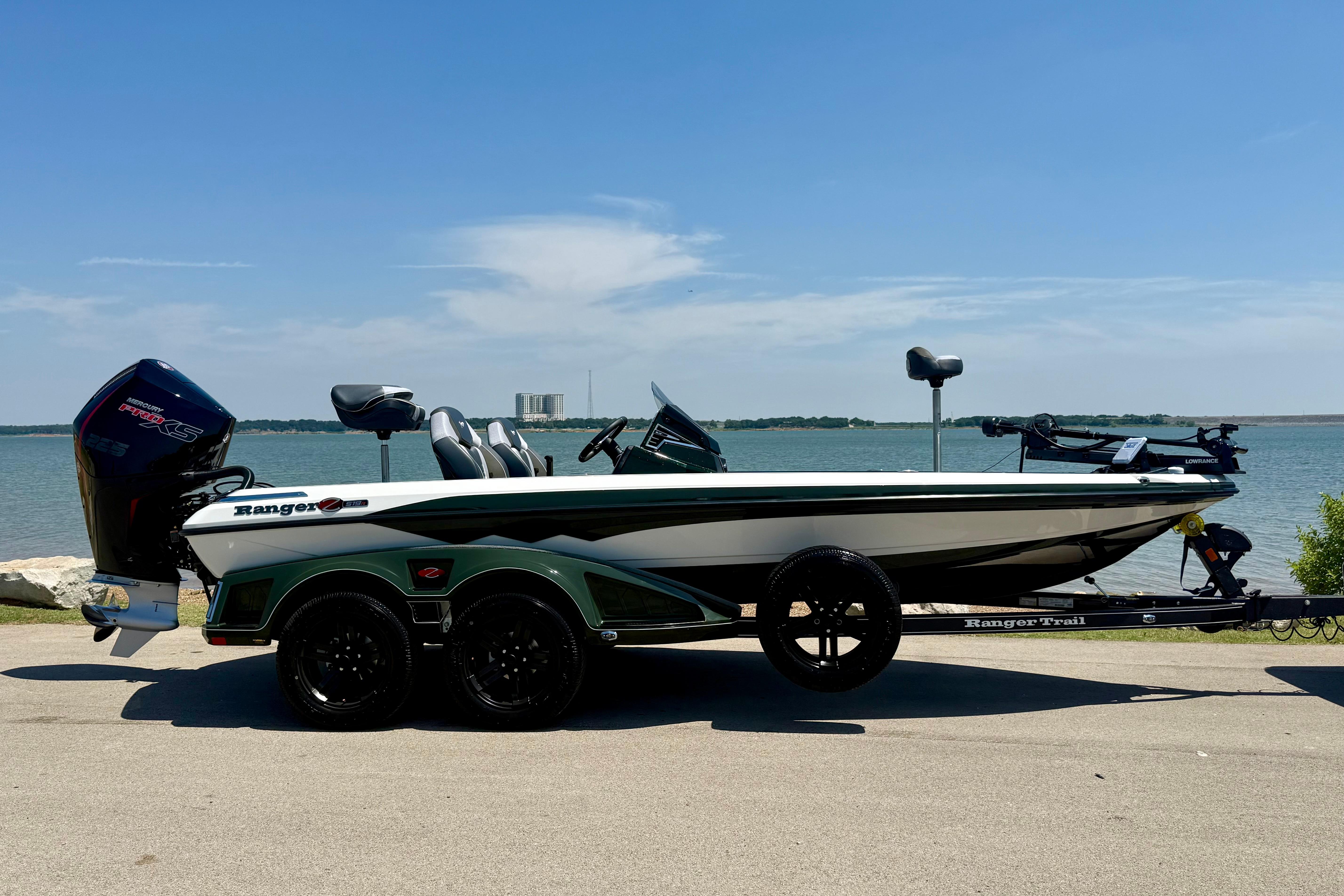 2026 Ranger Z519R boat parked by a lake under a clear blue sky.