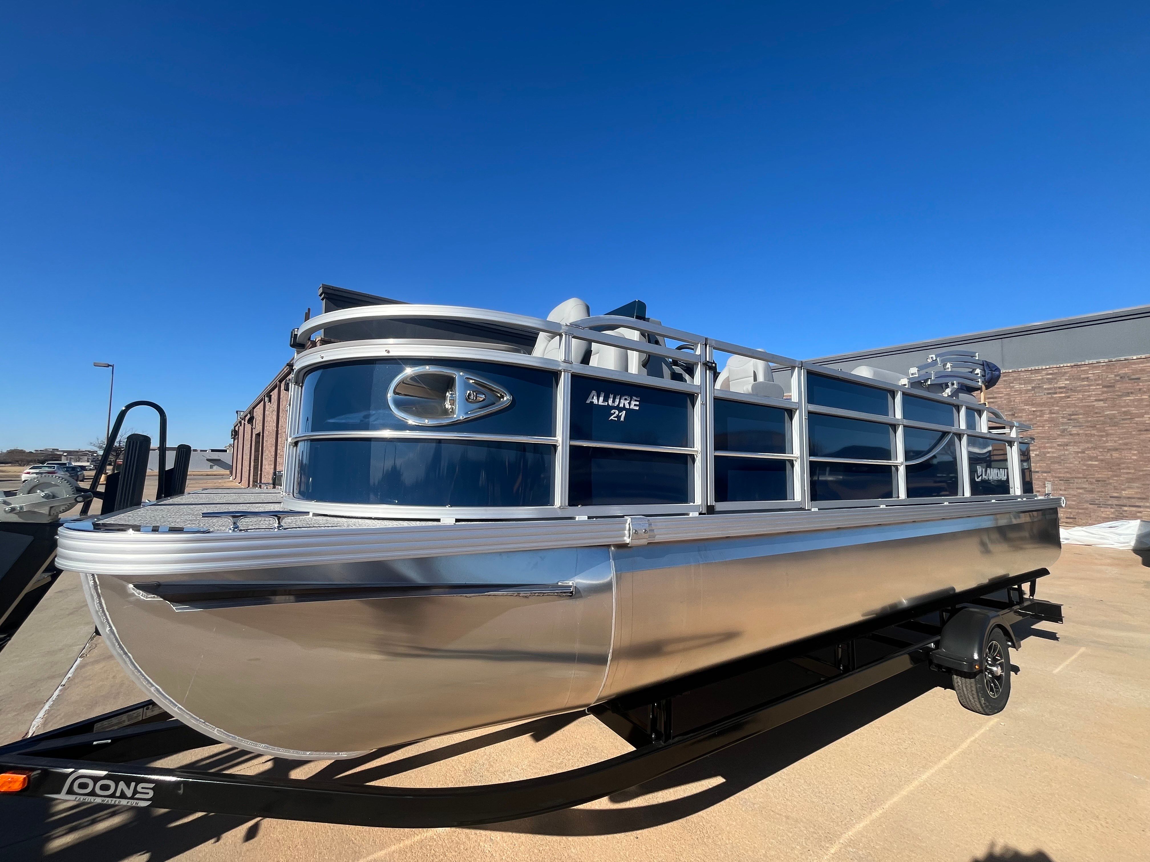 2026 Landau Alure 21CC Fish pontoon boat on trailer.