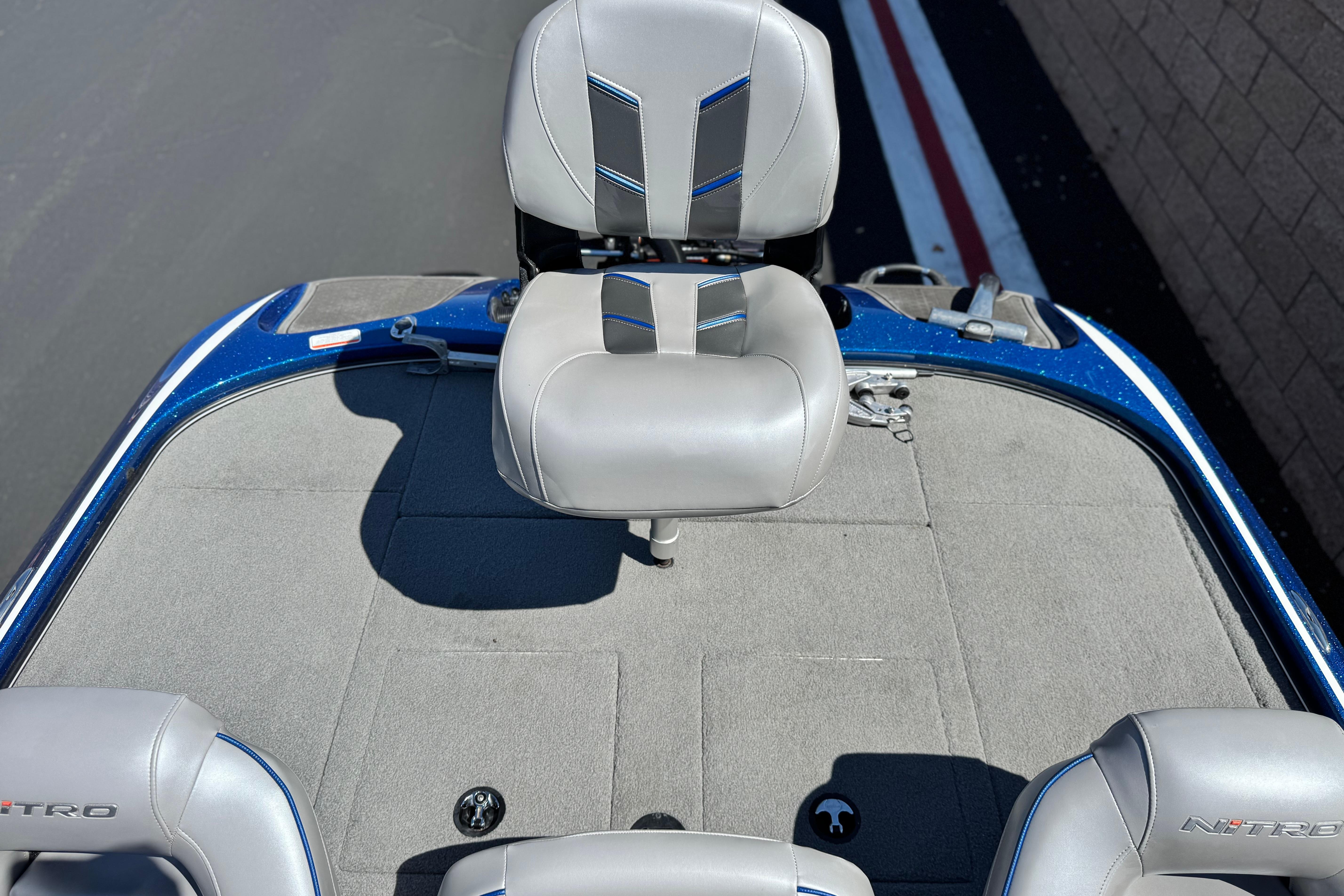 2022 Nitro Z19 boat interior with gray seating and blue accents.