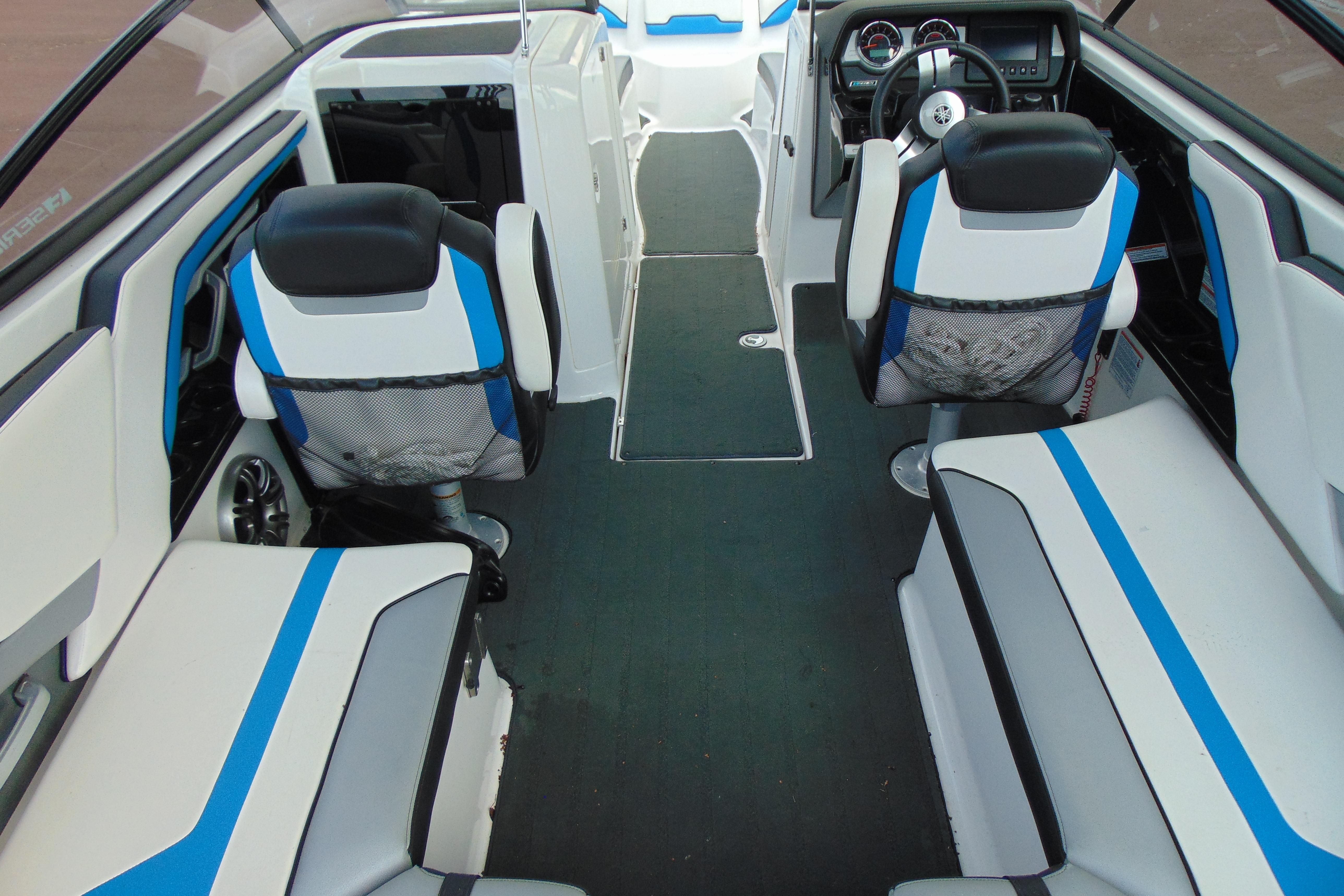 Interior of 2016 Yamaha Boats 242X E-Series, featuring modern seating and dashboard design.
