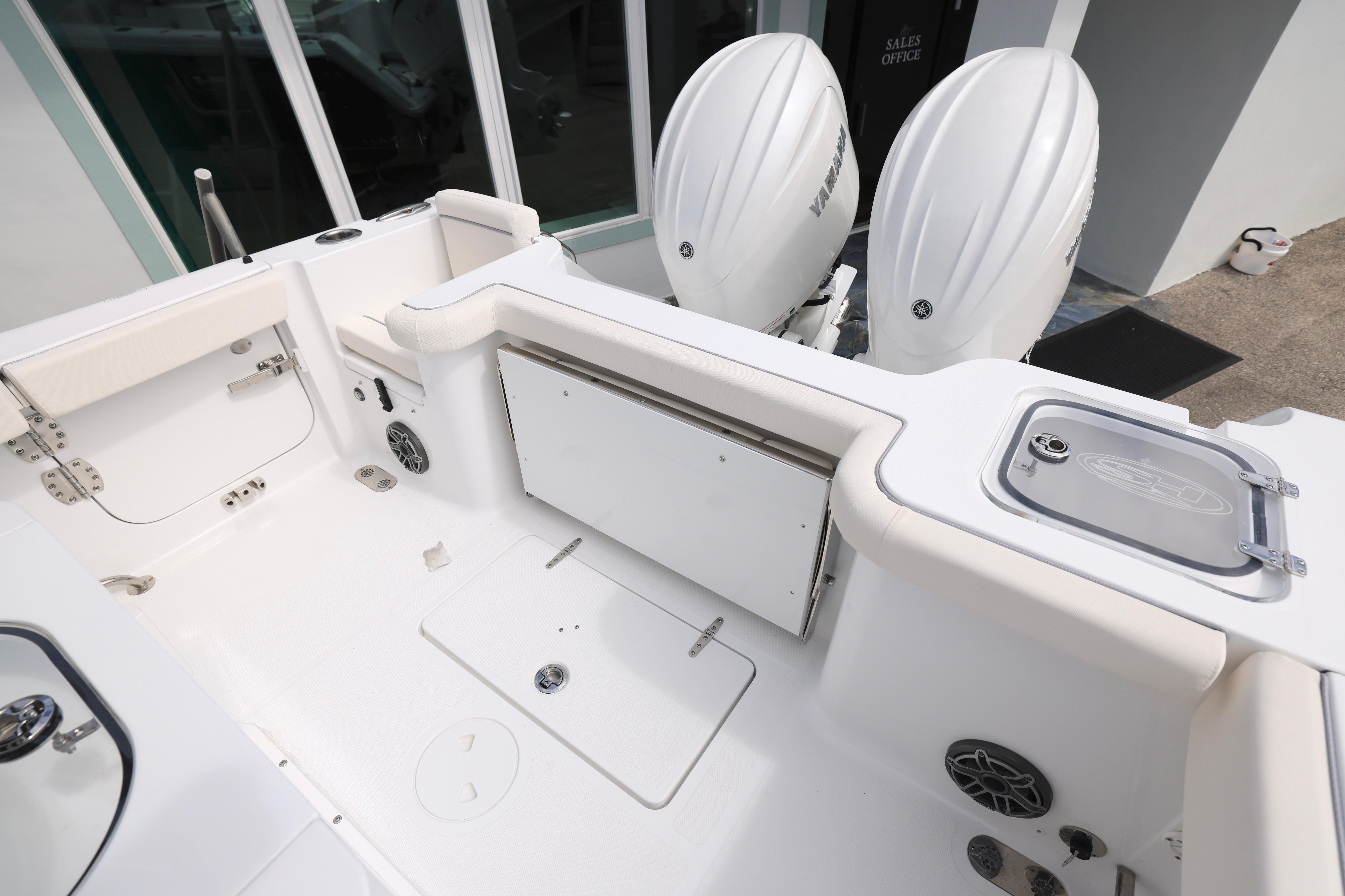 2026 Sea Hunt Gamefish 25 boat interior with dual Yamaha engines.